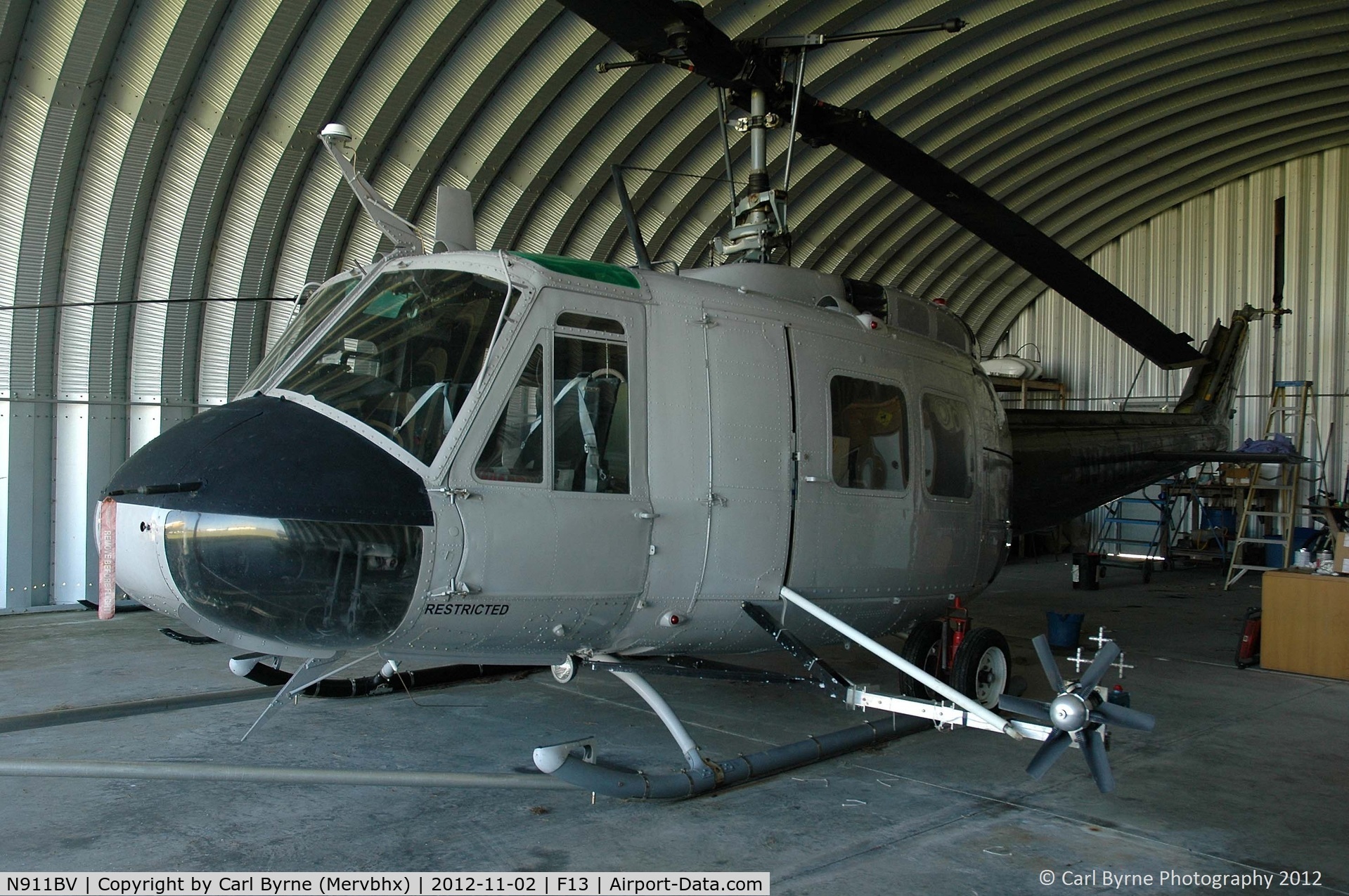 N911BV, 1966 Bell UH-1H C/N 65-09785, Inside one of the small hangars at Shell Creek Airpark.