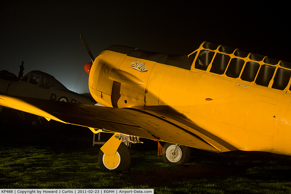 KF488, Noorduyn AT-16 Harvard IIB C/N 14A-2190, Bournemouth Aviation Museum night photo shoot. Close up of the nose, named 'Billie'.