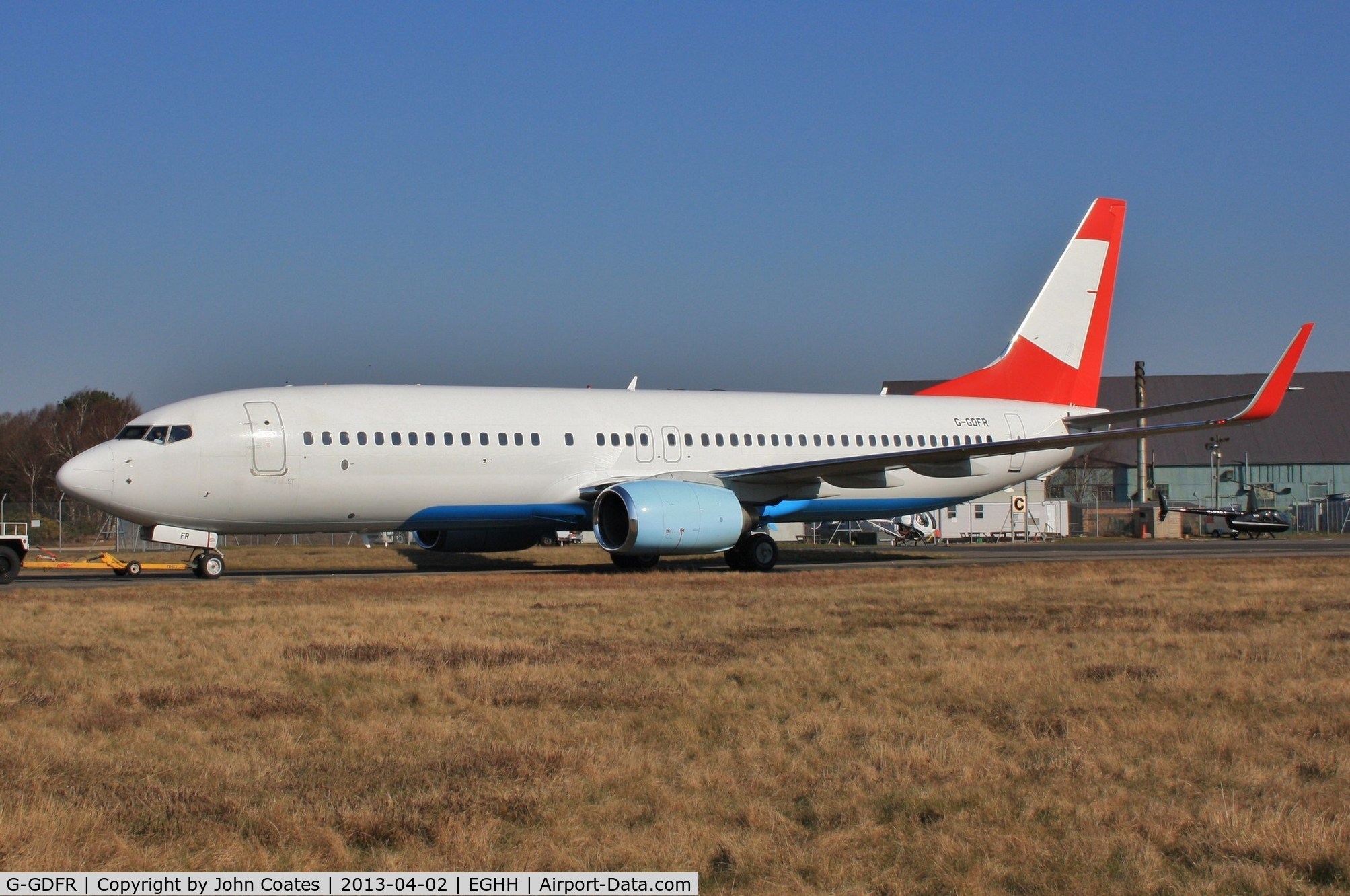 G-GDFR, 2003 Boeing 737-8Z9 C/N 30421, ex OE-LNQ being towed to paintshop for respray to Jet 2 livery