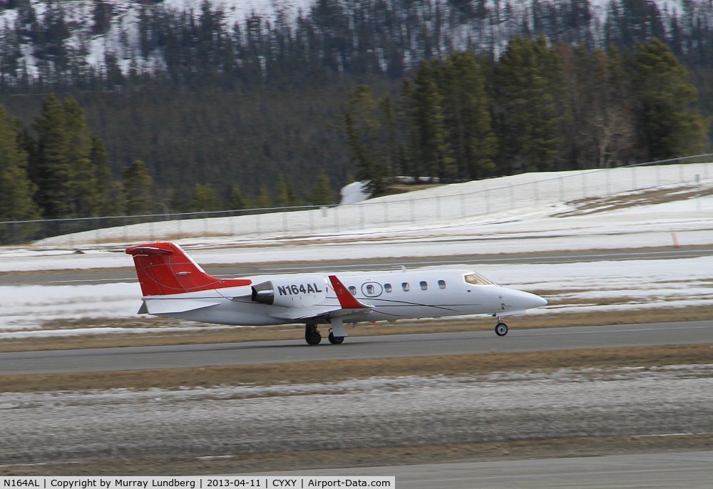 N164AL, 1997 Learjet Inc 31A C/N 31-134, Taking off at Whitehorse, Yukon (CYXY), bound for Anchorage, Alaska (ANC).