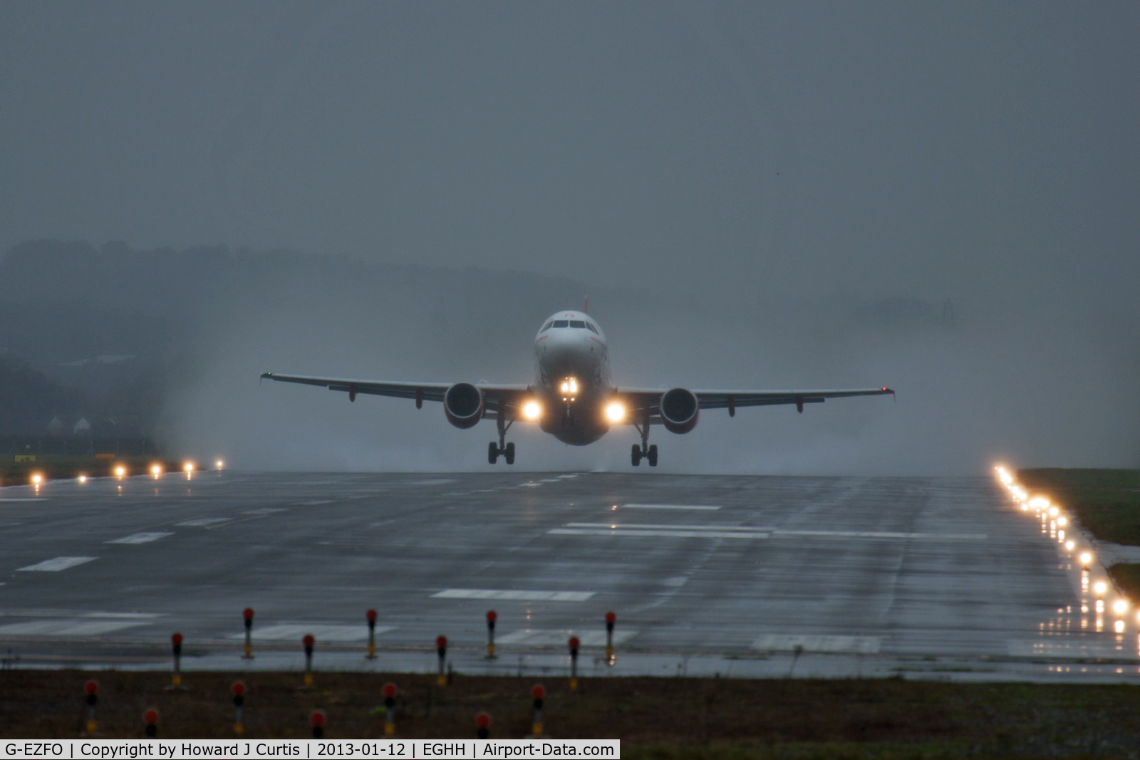 G-EZFO, 2009 Airbus A319-111 C/N 4080, Climbing out on a damp day.