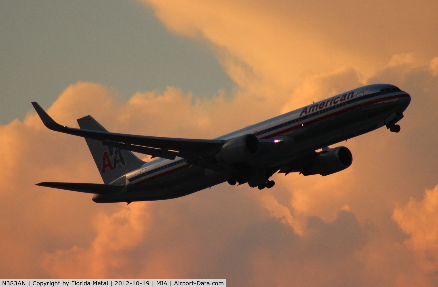 N383AN, 1993 Boeing 767-323 C/N 26995, Intended more to be artsy - American 767-300 taking off at dusk at Miami, shot from the Hilton - mighty storm cloud in the background making sky colorful