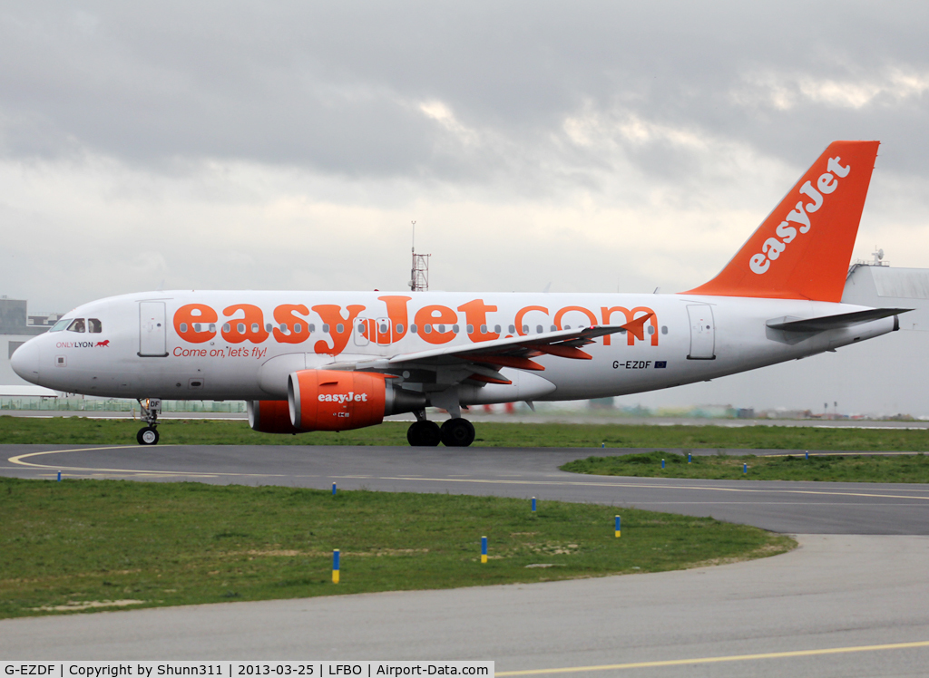 G-EZDF, 2008 Airbus A319-111 C/N 3432, Taxiing holding point rwy 32R with additional 'ONLY LYON' titles