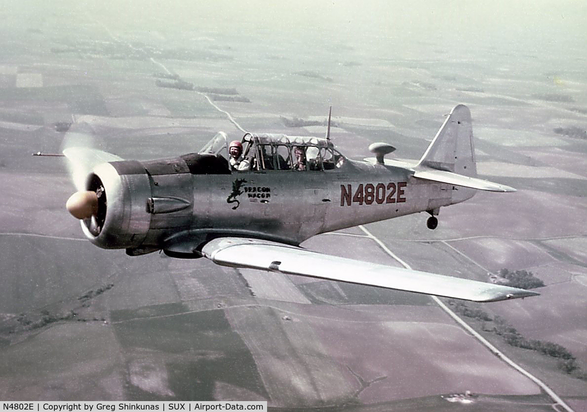 N4802E, 1961 North American AT-6A Texan C/N AJ-968, Photographed in flight West of Sioux City Municipal Airport (now Sioux Gateway airport), around 1964.  Pilot/Owner at that time was John J. Shinkunas.