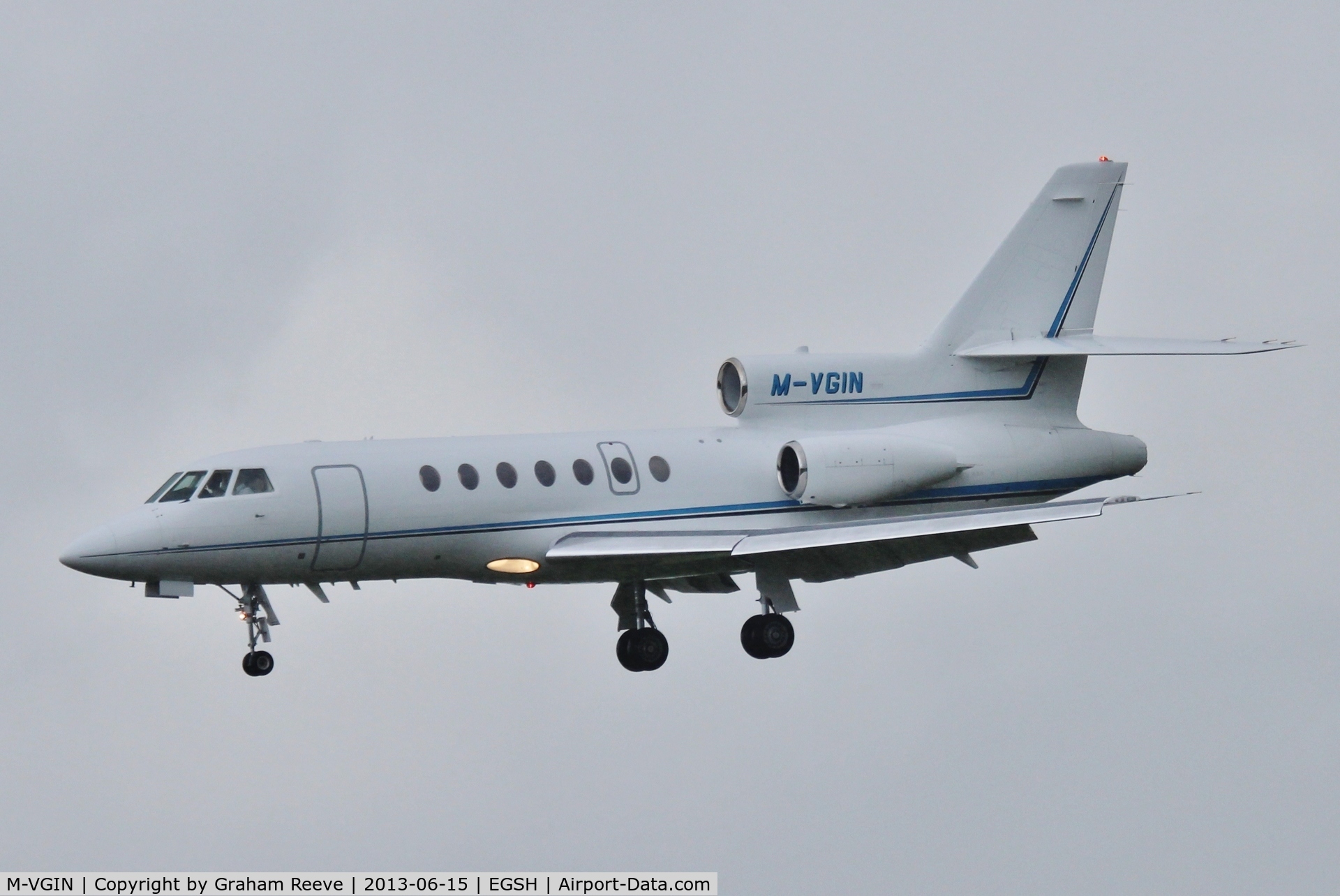 M-VGIN, 2001 Dassault Falcon 50EX C/N 320, About to land in heavy rain at Norwich.