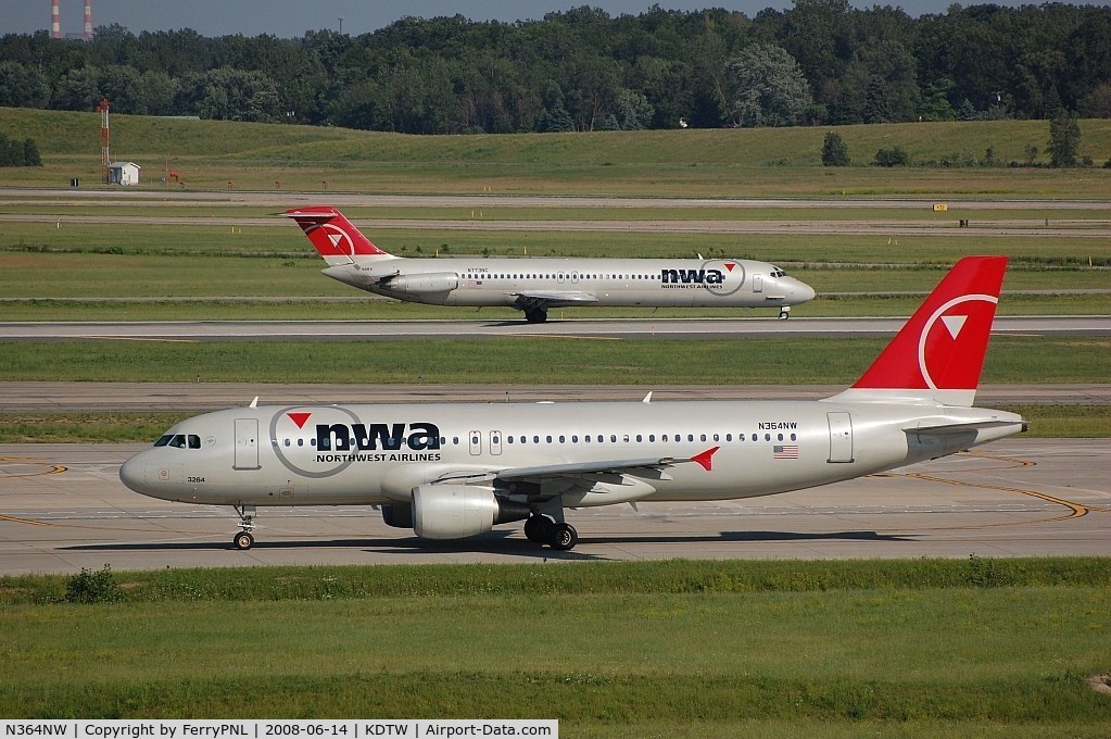 N364NW, 1999 Airbus A320-212 C/N 0962, NWA A320 passing a DC9