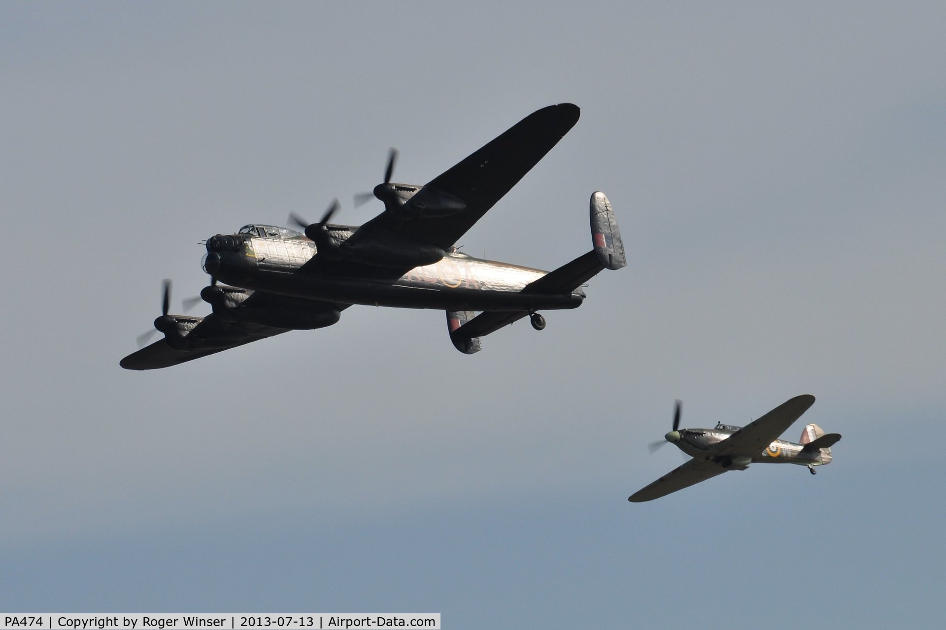 PA474, 1945 Avro 683 Lancaster B1 C/N VACH0052/D2973, Off airport. Five Merlins. BBMF Lancaster coded KC-A with little friend Hurricane IIc LF363 coded YB-W displaying on the first day of the Wales National Air Show, Swansea Bay, Wales, UK.