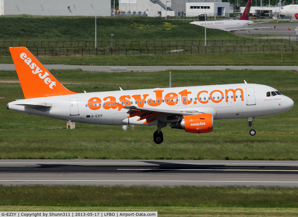 G-EZIY, 2005 Airbus A319-111 C/N 2636, Landing rwy 14R without 'Come On, Let's Fly' titles but with additional 'Discover Scotland' titles on cockpit...