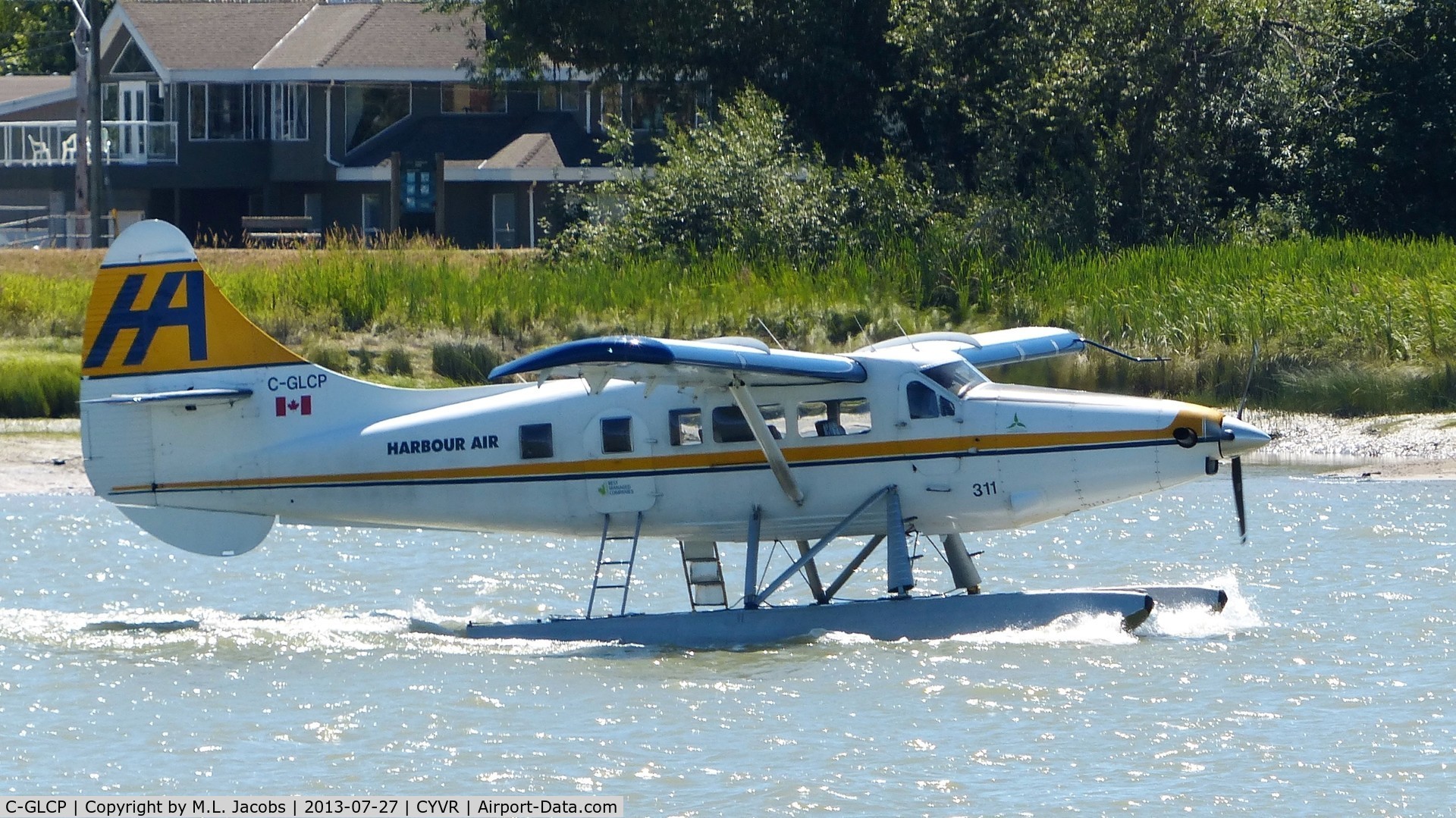 C-GLCP, 1961 De Havilland Canada DHC-3T Vazar Turbine Otter C/N 422, Harbour Air #311 taxiing to the Fraser River terminal.