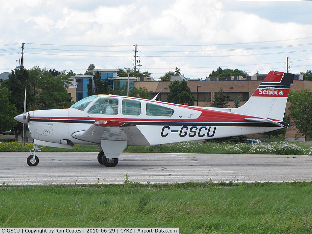 C-GSCU, 1992 Beech F33A Bonanza C/N CE-1695, This 1992 Beech Bonanza of the Seneca College Flying School waiting to be cleared off runway 33 at Buttonville Airport (CYKZ)