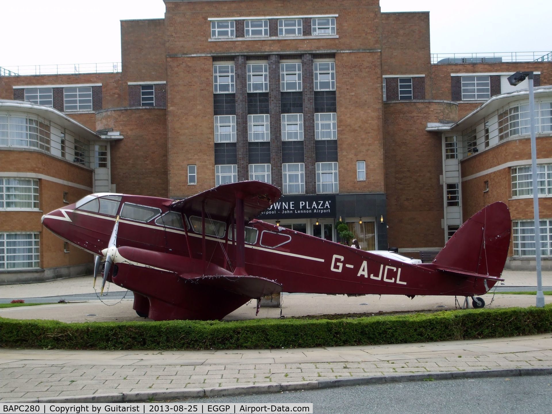 BAPC280, 1944 De Havilland DH-89A Rapide Replica C/N BAPC280, This replica Dragon Rapide is outside the entrance to the Crowne Plaza hotel situated in the old terminal building at Liverpool Airport.
