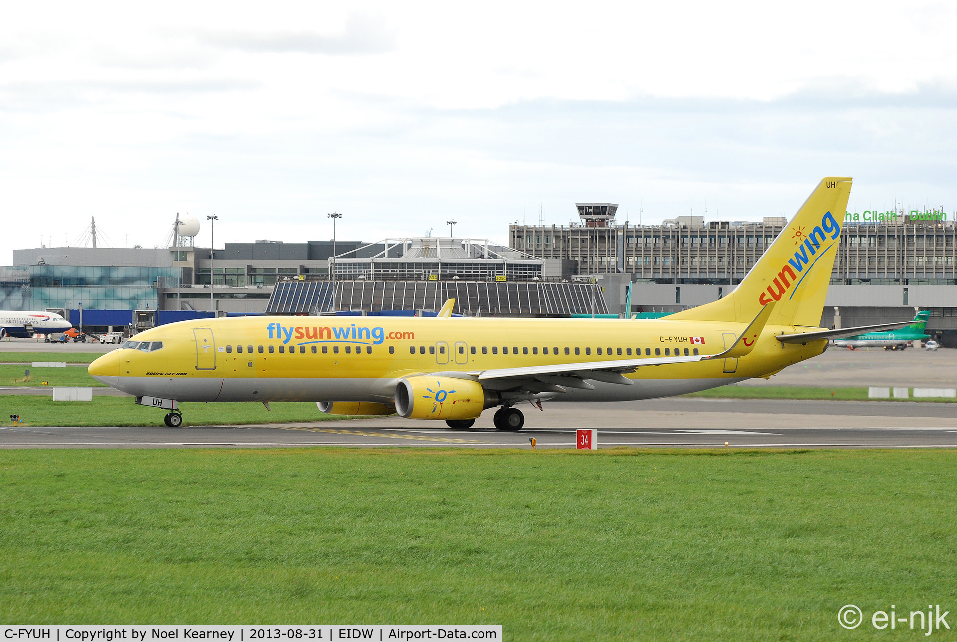 C-FYUH, 2006 Boeing 737-8K5 C/N 34689, On lease to Thomson for holiday charters and seen about to depart off Rwy28 at Dublin.