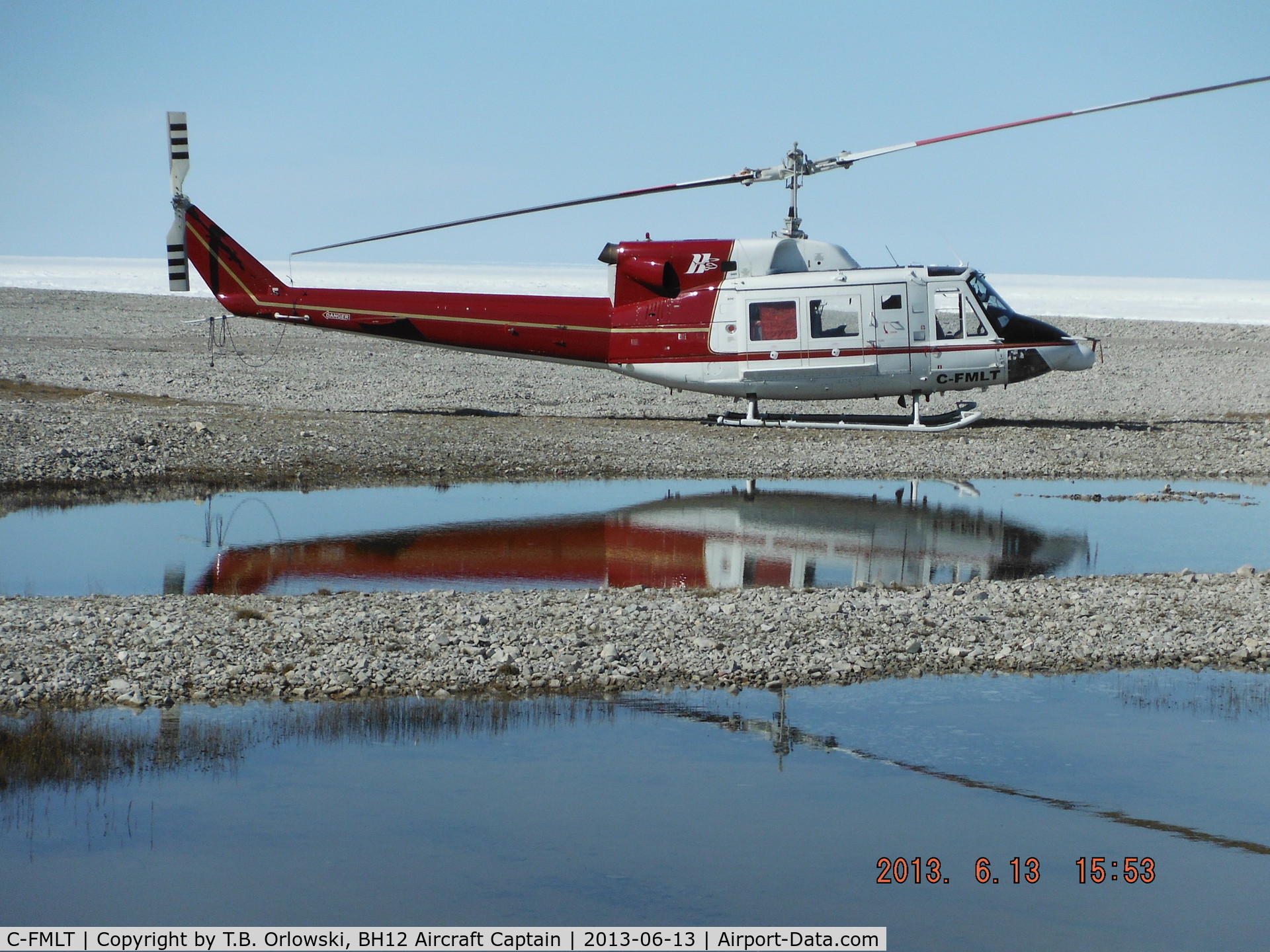 C-FMLT, 1978 Bell 212 C/N 30889, Harding River, Nunavut, Canada (North West Passage) near the beach tanks.  C-FMLT is based in Cambridge Bay (CYCB): it is one of the HTSC helicopters currently contracted for flight operations in support of the North Warning System (NWS).