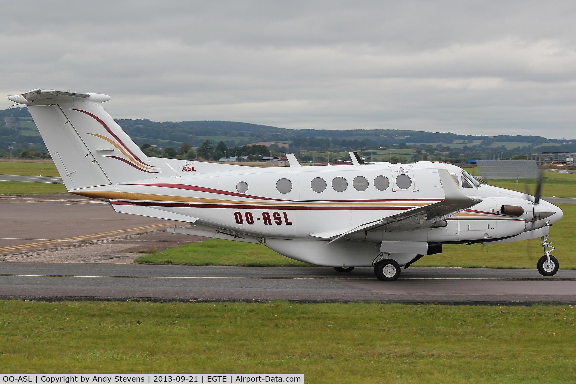 OO-ASL, 1982 Beech 200C Super King Air C/N BL-49, Taxiing for departure from R26 at Exeter