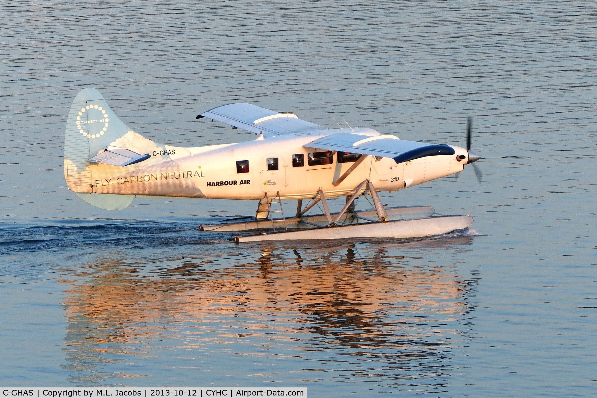 C-GHAS, 1958 De Havilland Canada DHC-3 Otter C/N 284, Harbour Air #310 departing Coal Harbour terminal shortly after sunrise.