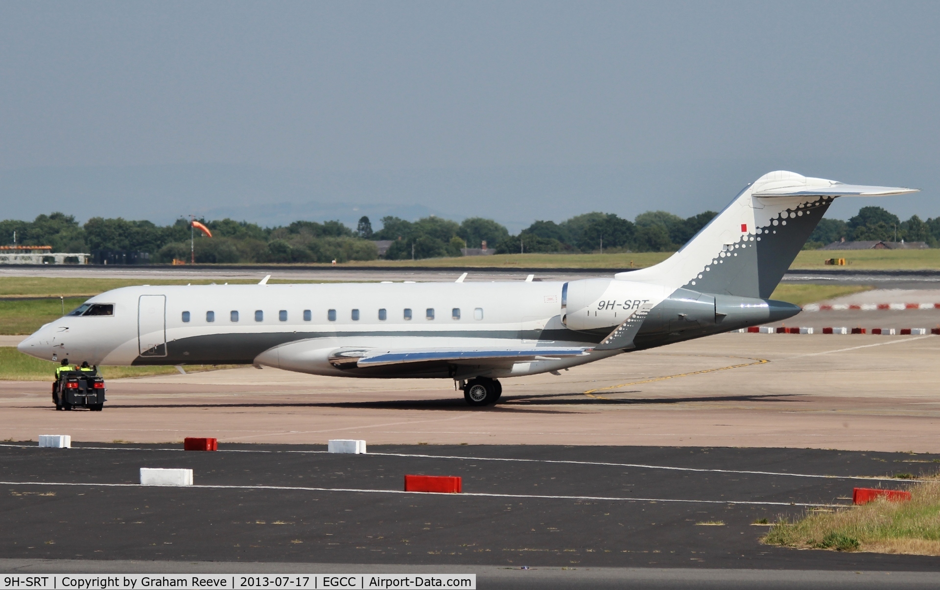 9H-SRT, 2008 Bombardier BD-700-1A10 Global Express C/N 9274, Under tow at Manchester.
