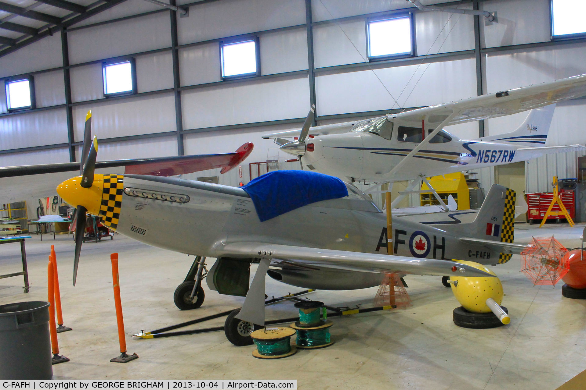 C-FAFH, 1999 Mustang F.E.W. TP-51 C/N 0051, Tucked into a hangar at Muskoka airport, Ontario