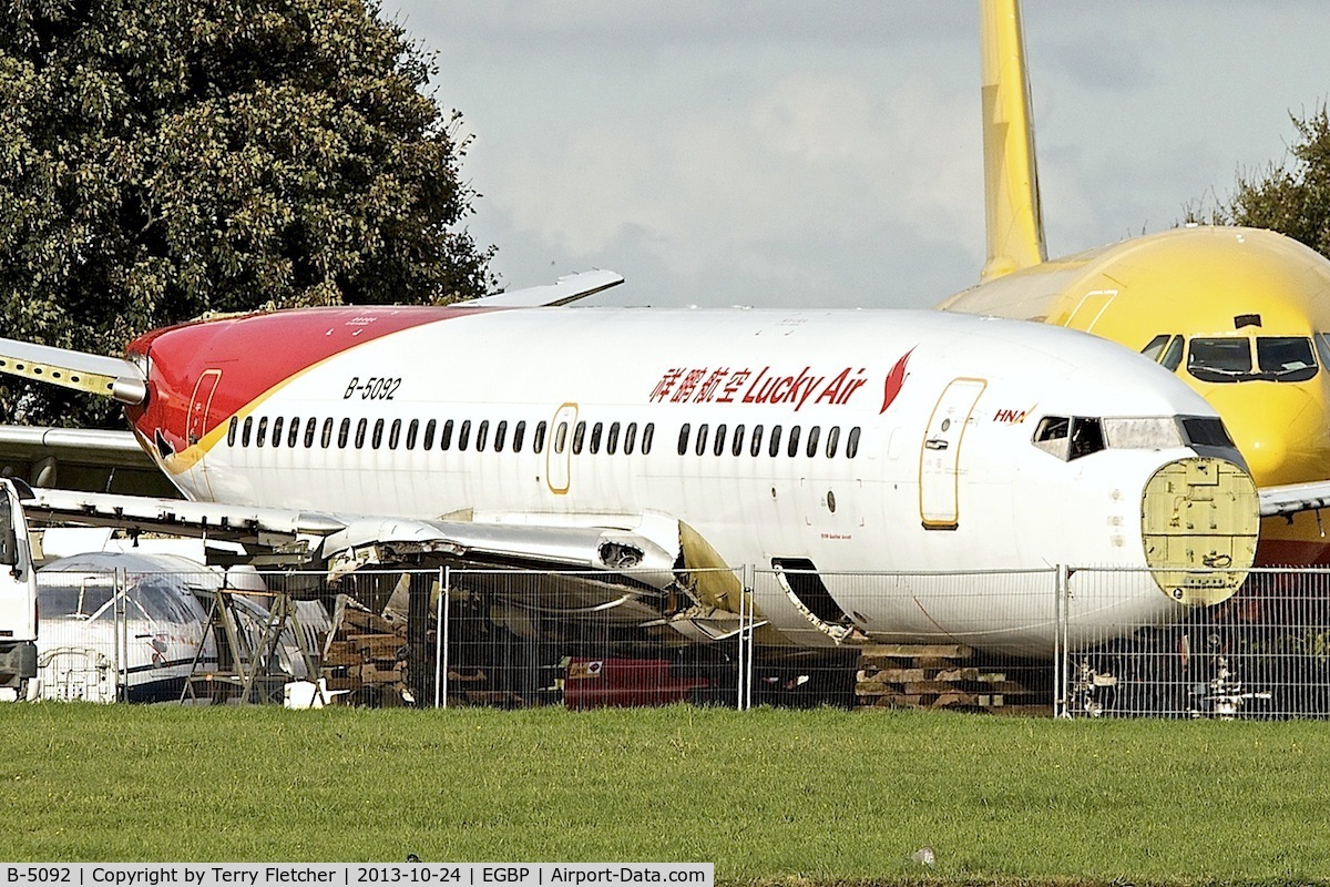 B-5092, 1999 Boeing 737-705 C/N 29092, The inappropriately named Lucky Air B737 c/n 29092 ex LN-TUG, VH-VBX  under the axe at Kemble