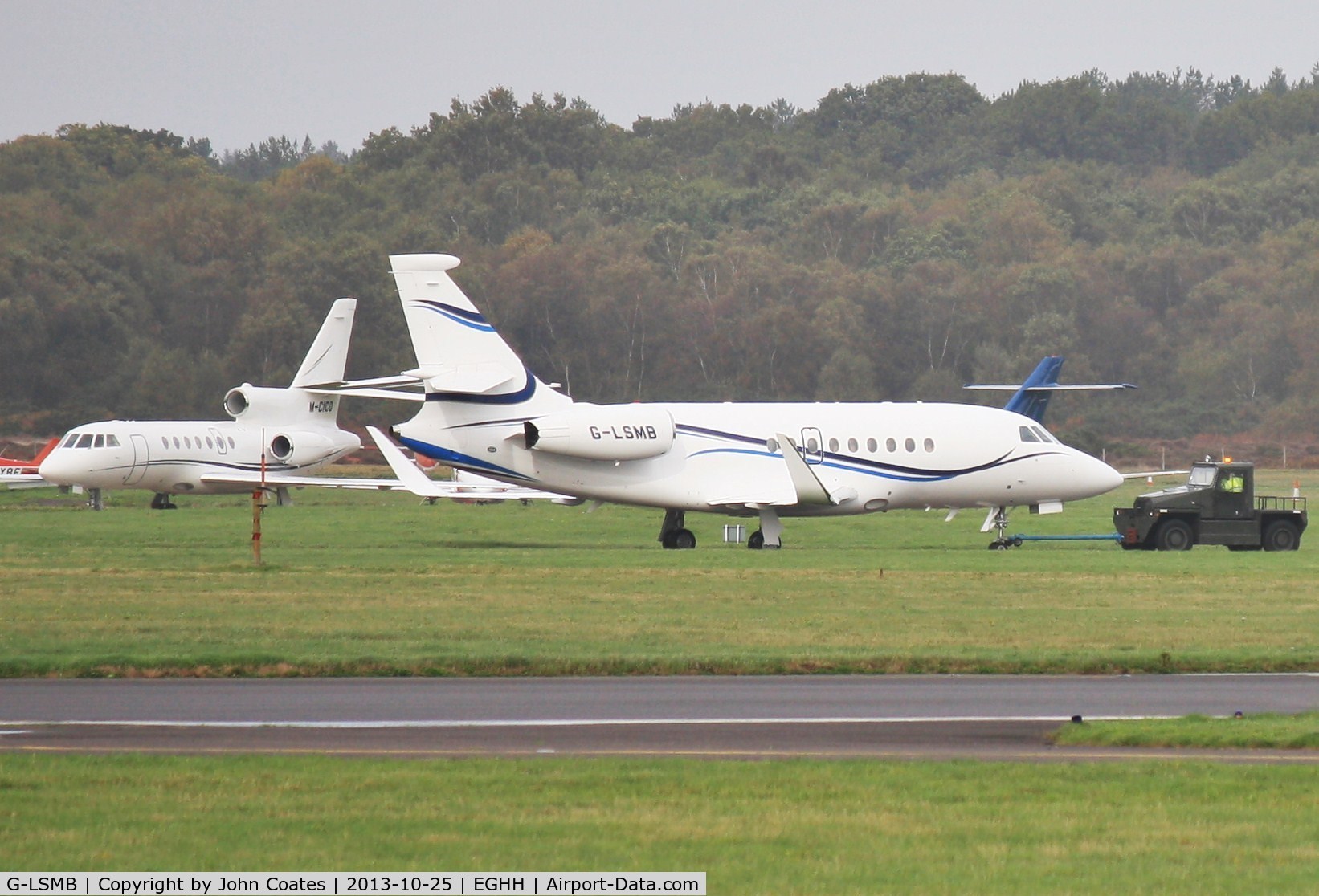 G-LSMB, 2004 Dassault Falcon 2000EX C/N 47, Being towed past M-CICO