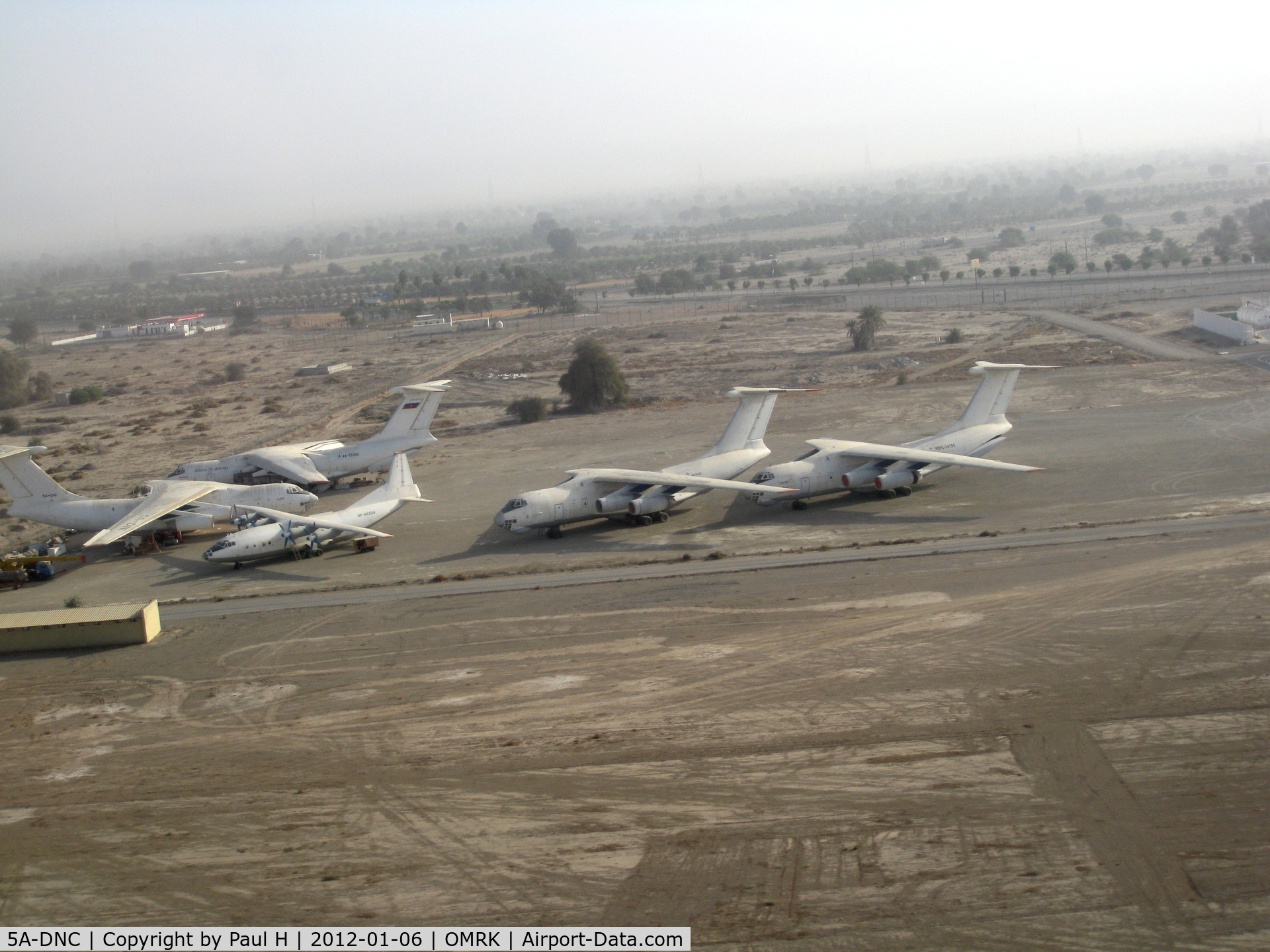 5A-DNC, Ilyushin IL76TD C/N 002347084, 4 Il-76 and an An-12 at the airfield of Ras Al Khaimah (RKT) in the UAE