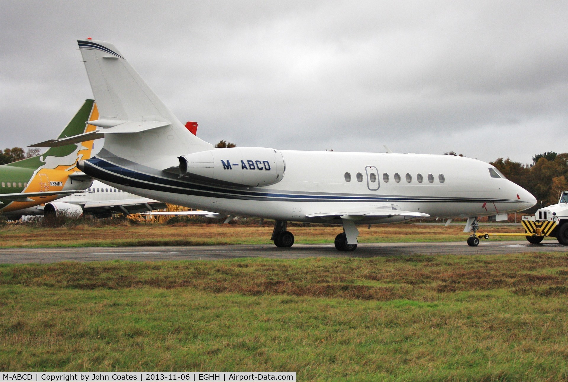 M-ABCD, 1999 Dassault Falcon 2000 C/N 98, Being towed from Thurston Aviation.