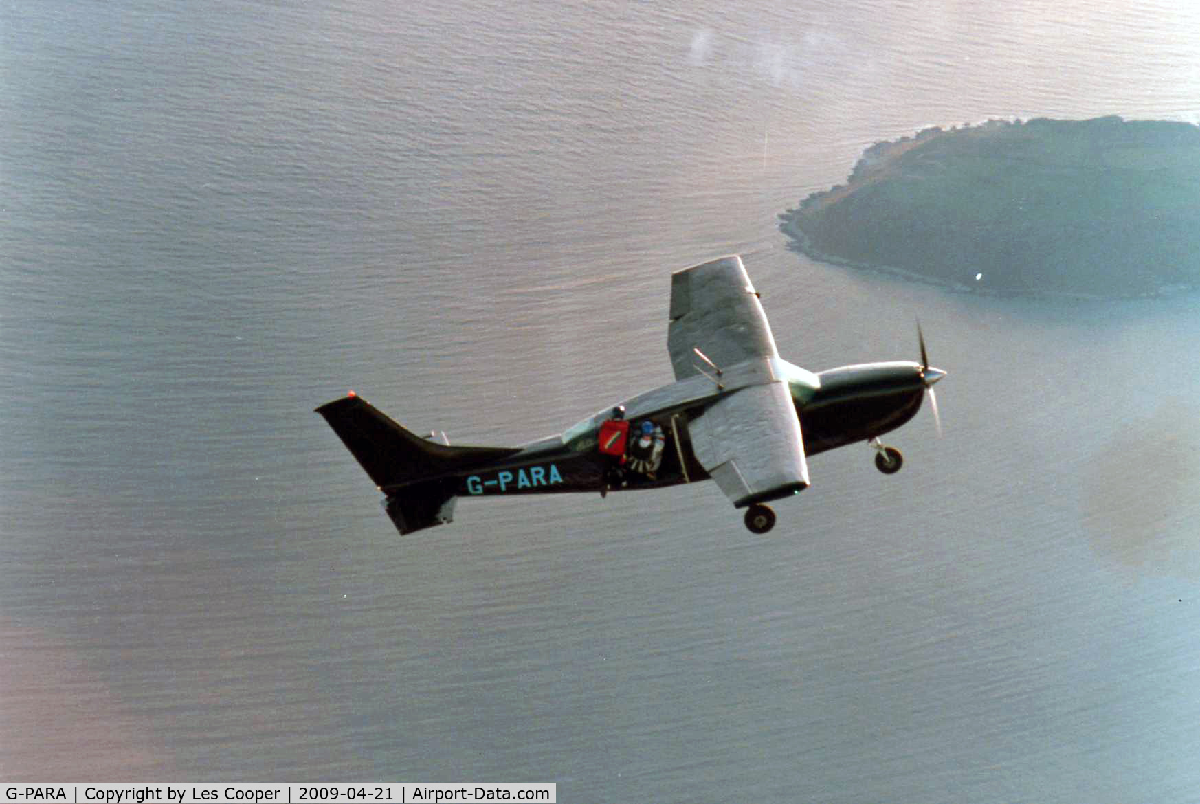 G-PARA, 1970 Cessna 207 Skywagon C/N 207-00153, Skydivers climb out of G-PARA over The Gower on the run-in to Swansea Parachute Club Drop Zone.