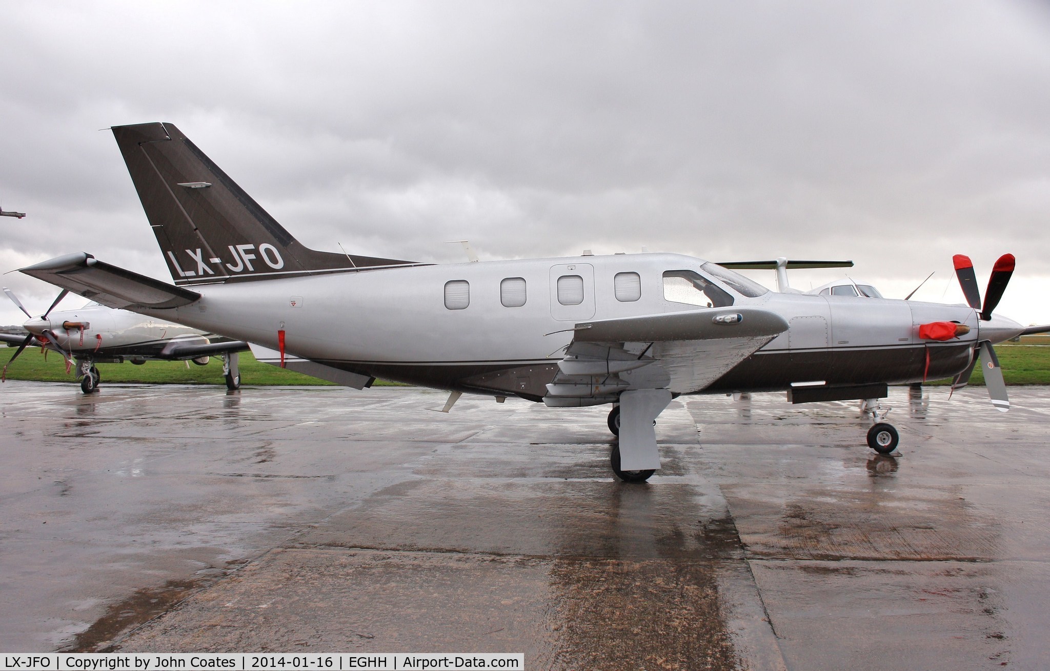 LX-JFO, 2007 Socata TBM-850 C/N 422, Parked in rain after overnight stay
