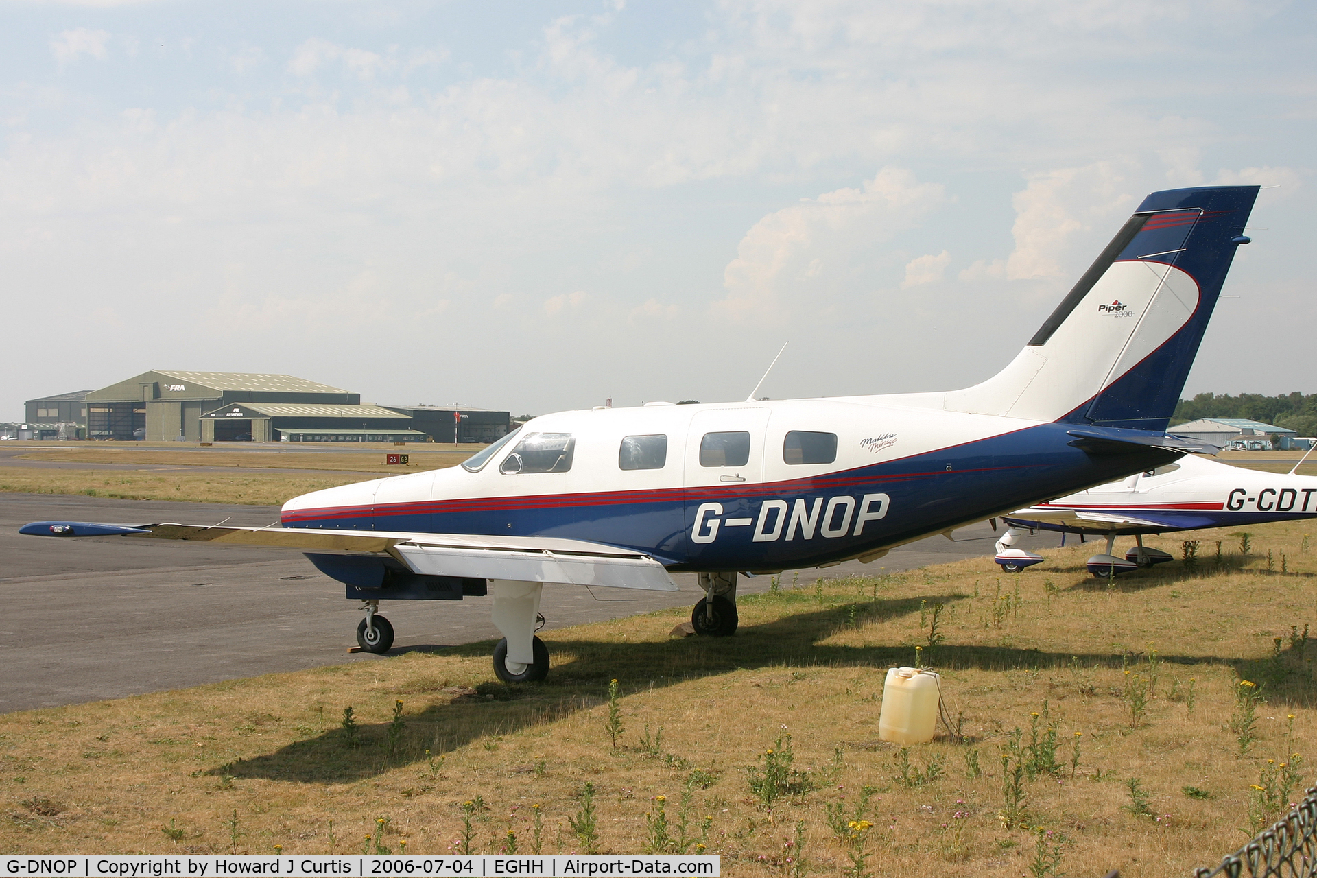 G-DNOP, 2000 Piper PA-46-350P Malibu Mirage C/N 4636303, Parked outside, minus engine.