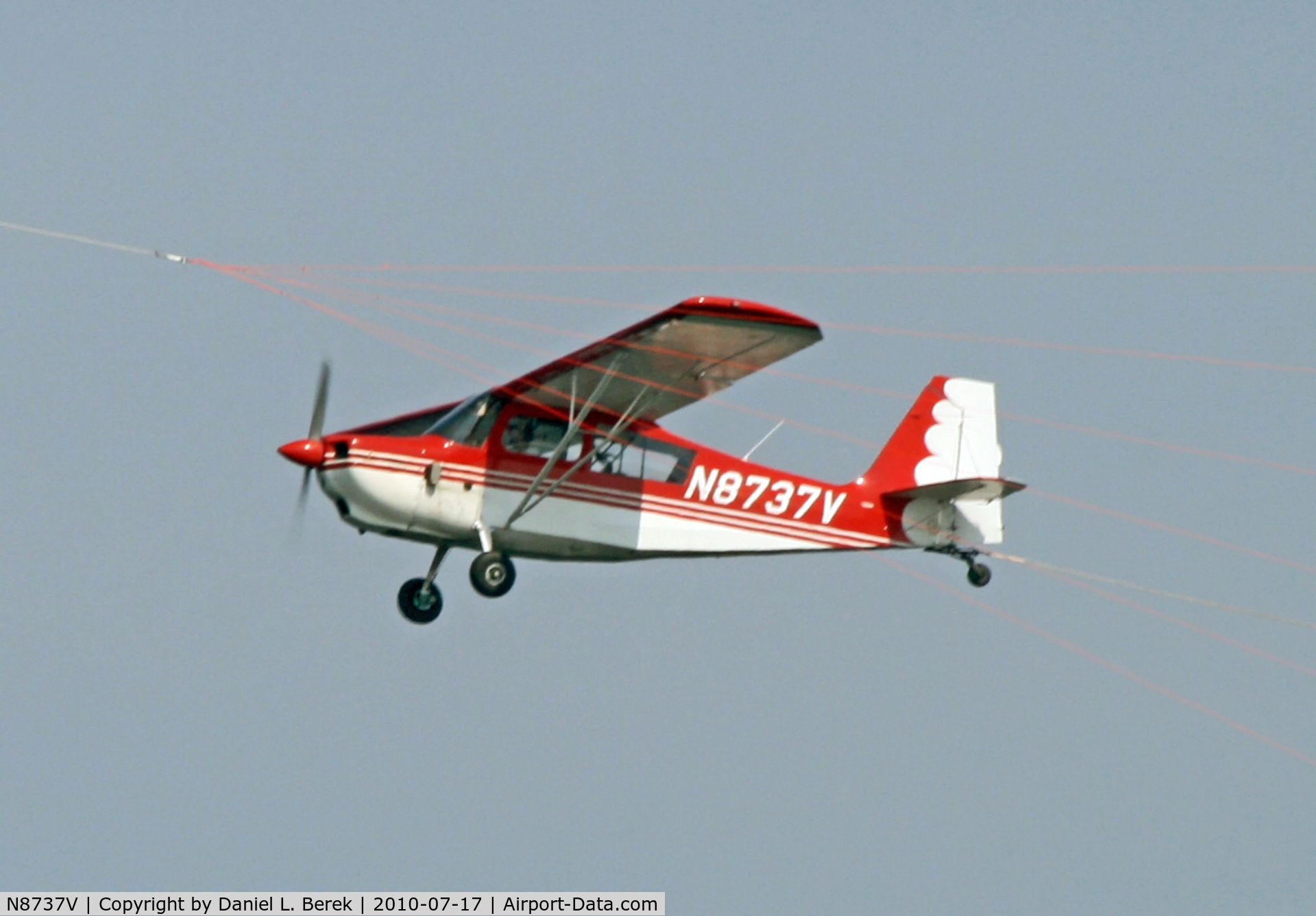 N8737V, 1975 Bellanca 7GCBC C/N 848-75, A Bellanca banner tow plane tries to catch up with another aircraft flying ahead, as seen off the coast of Point Pleasant Beach, NJ.
