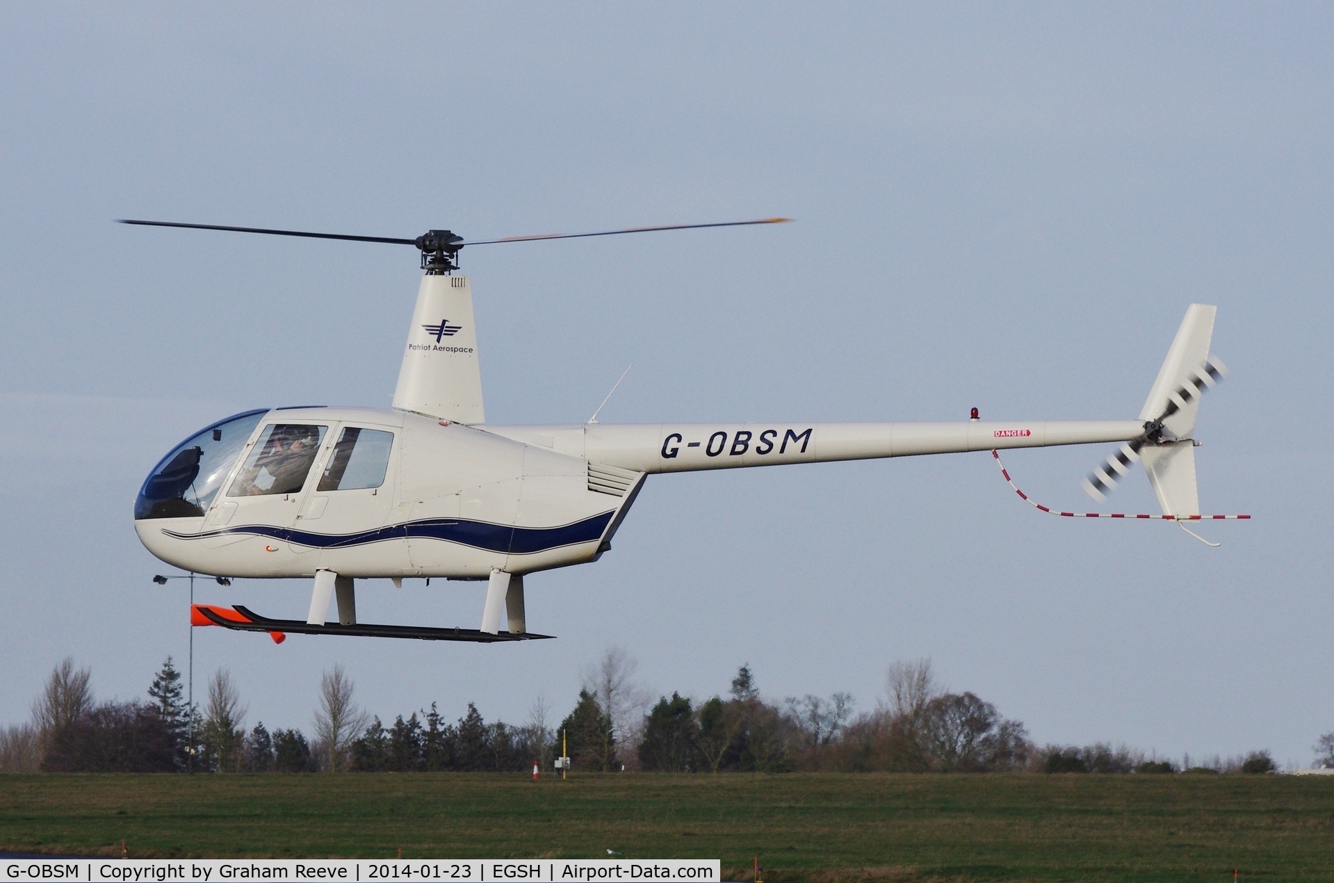 G-OBSM, 2001 Robinson R44 Raven C/N 1030, About to touch down.