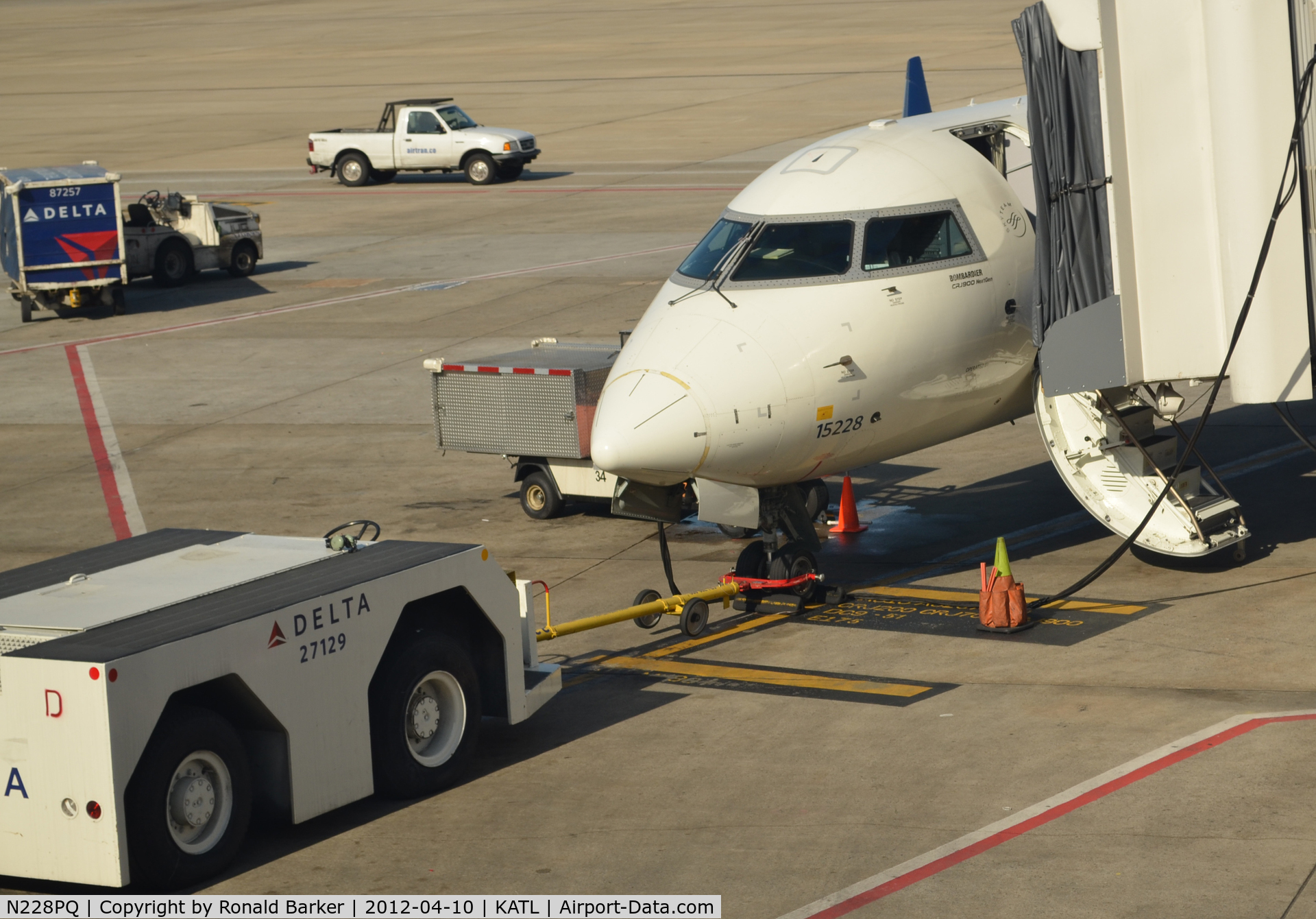 N228PQ, 2009 Bombardier CRJ-900ER (CL-600-2D24) C/N 15228, Fleet number 15228 connected to tug Atlanta