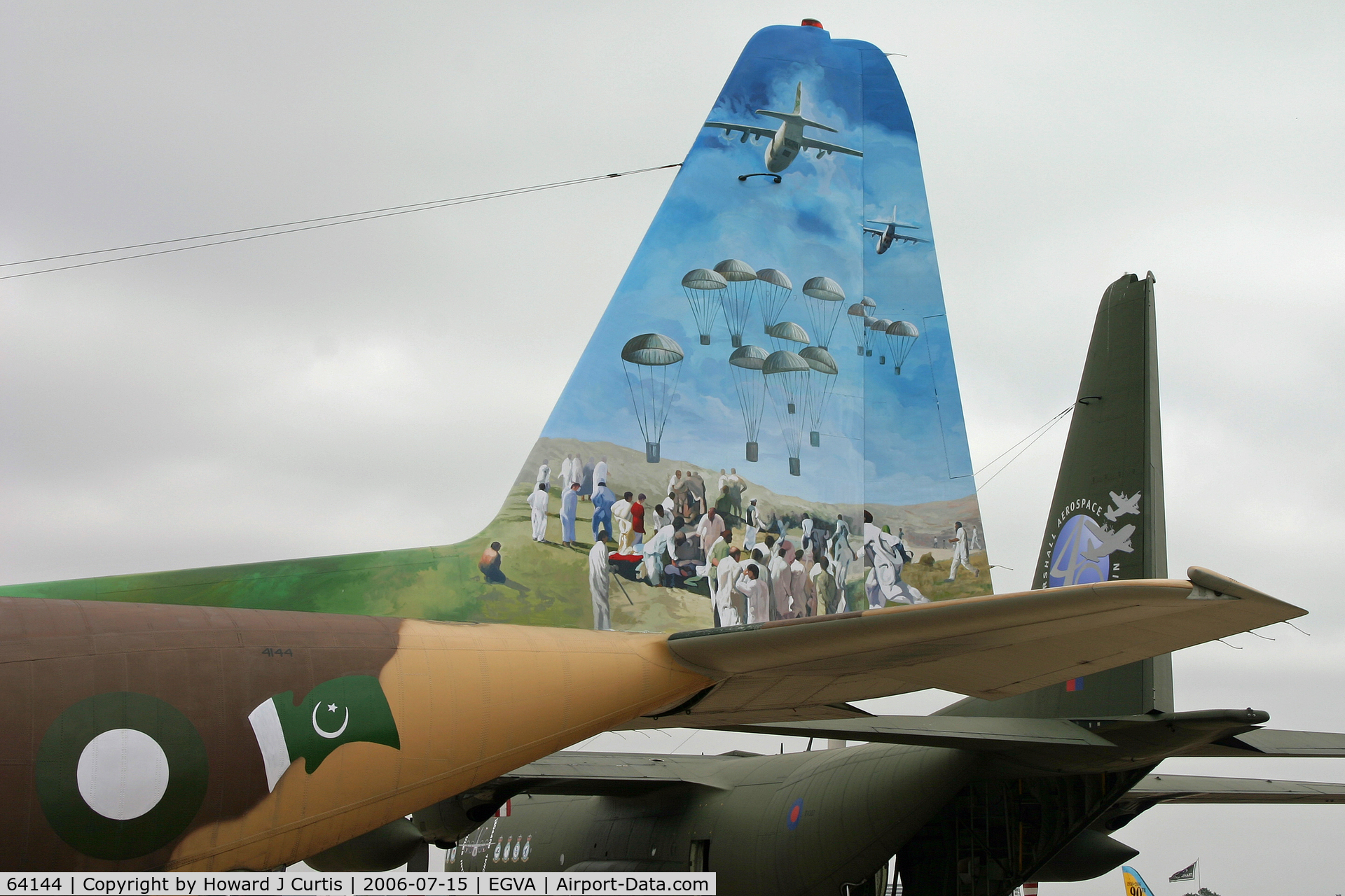 64144, Lockheed L-100-20 Hercules C/N 382-4144, RIAT 2006; on static display. Pakistan AF, showing artwork on port side of tail. RAF C-130K XV307 behind with 40th anniversary artwork.