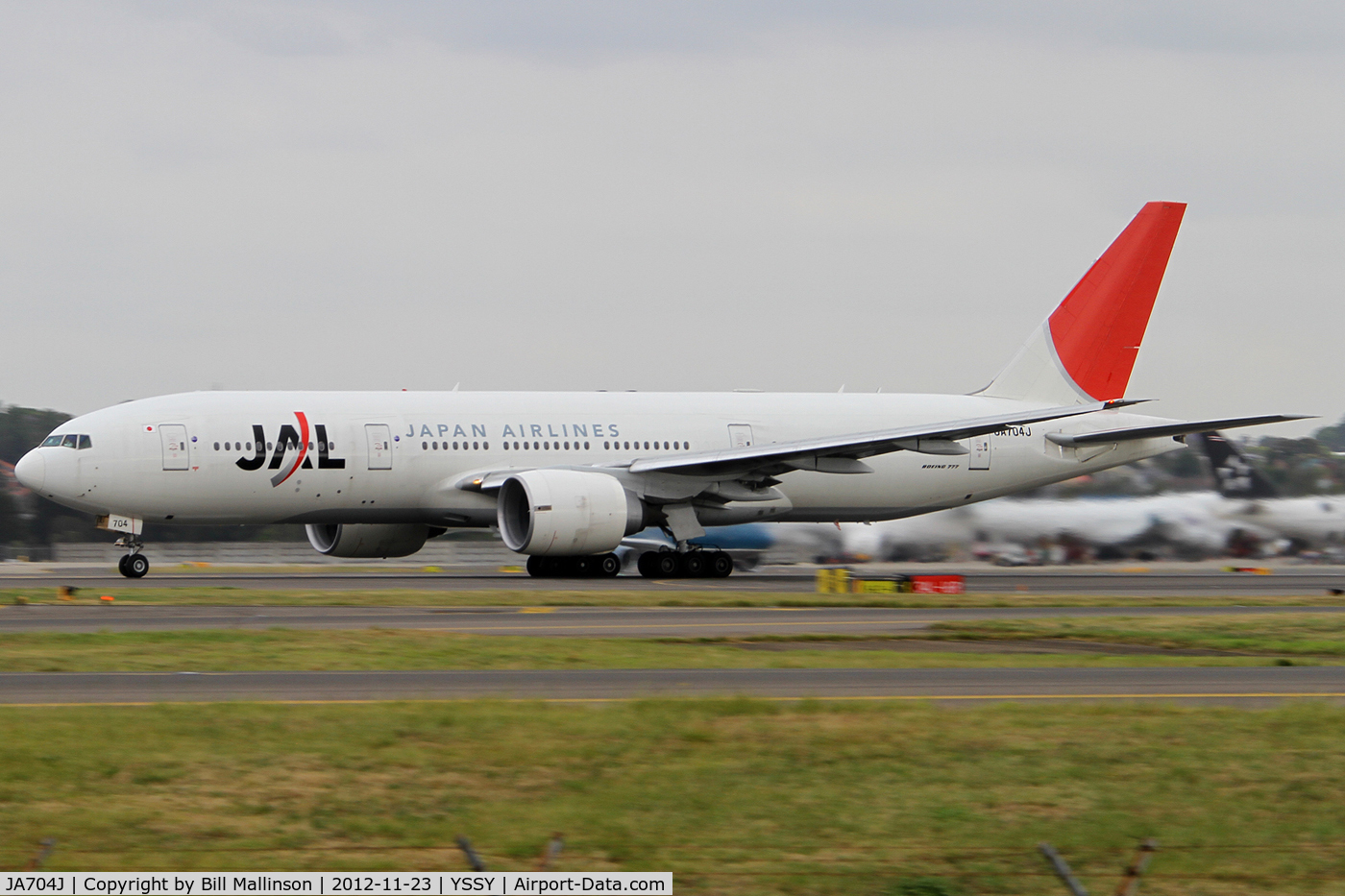 JA704J, 2003 Boeing 777-246/ER C/N 32892, rolling on 16R