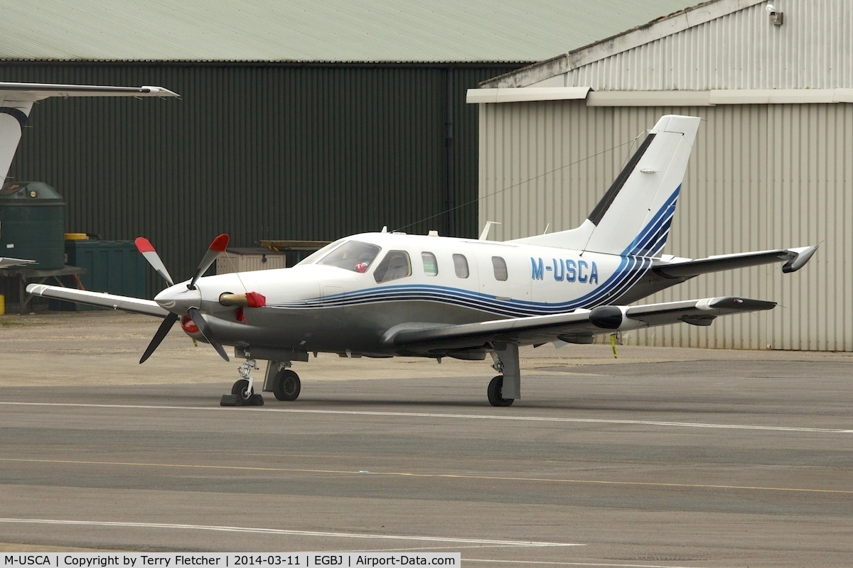 M-USCA, 2008 Socata TBM-700N C/N 456, Socata TBM 850 at Gloucestershire Airport on Day 1 of the 2014 Cheltenham Horse Racing Festival