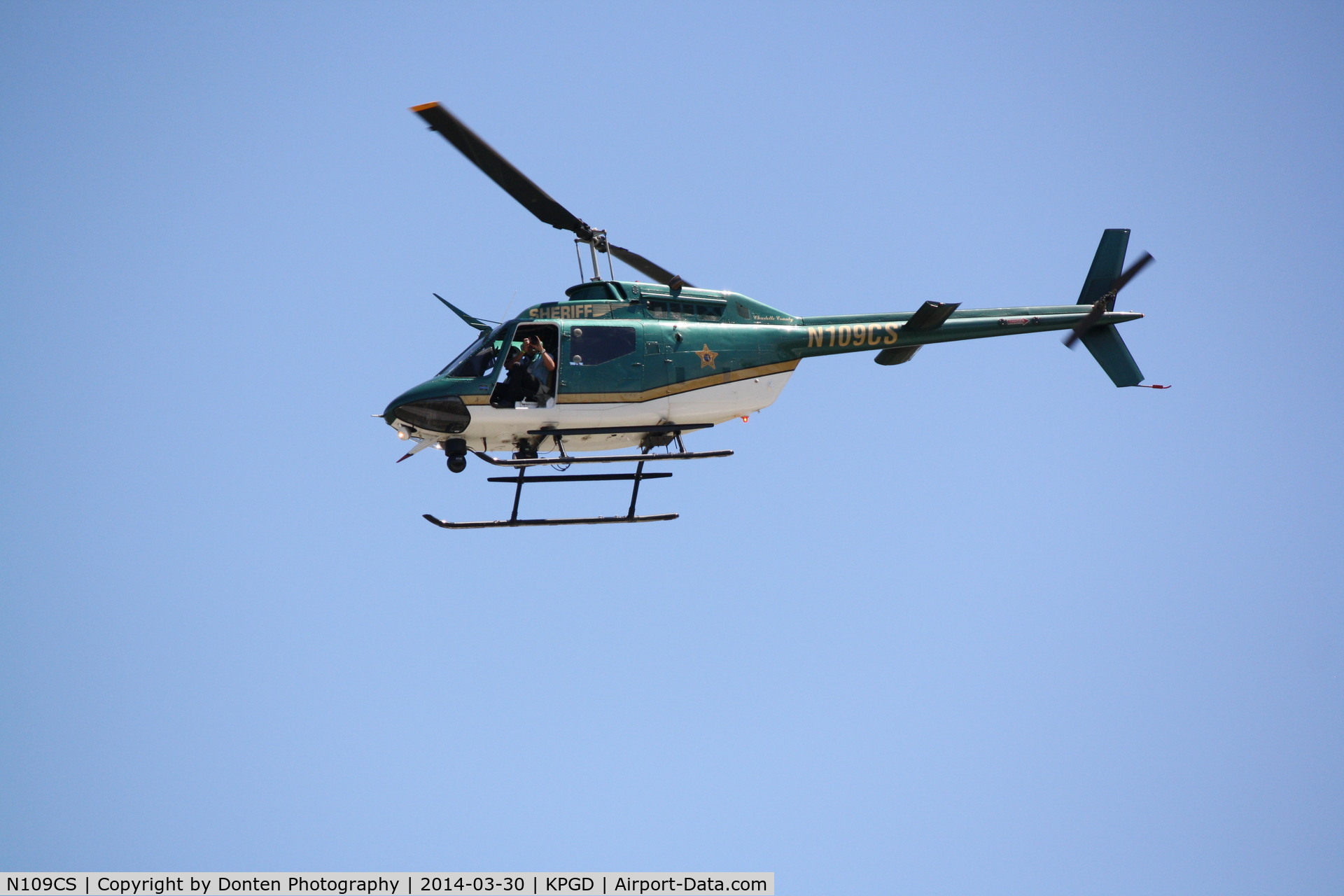 N109CS, Bell OH-58C C/N 72-21282, Charlotte County Sheriff's Office helicopter (N109CS) flies over the Florida International Air Show