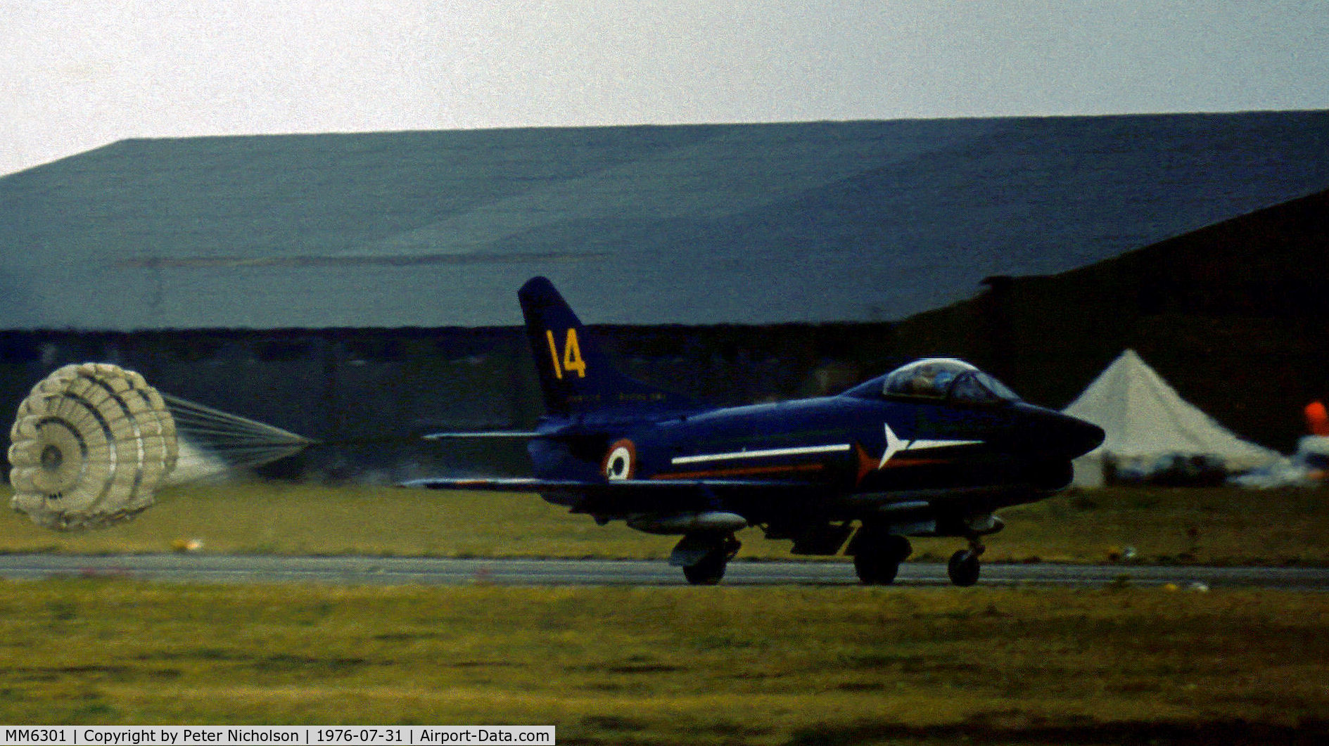 MM6301, Fiat G-91PAN C/N 165, G-91PAN number 14 of the Italian Air Force's Frecce Tricolori demonstration team in action at the 1976 Intnl Air Tattoo at RAF Greenham Common.