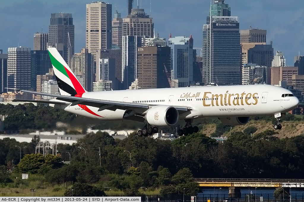 A6-ECR, 2009 Boeing 777-31H/ER C/N 35592, Emirates B777-300 on approach to Sydney with the city skyline in the bakground