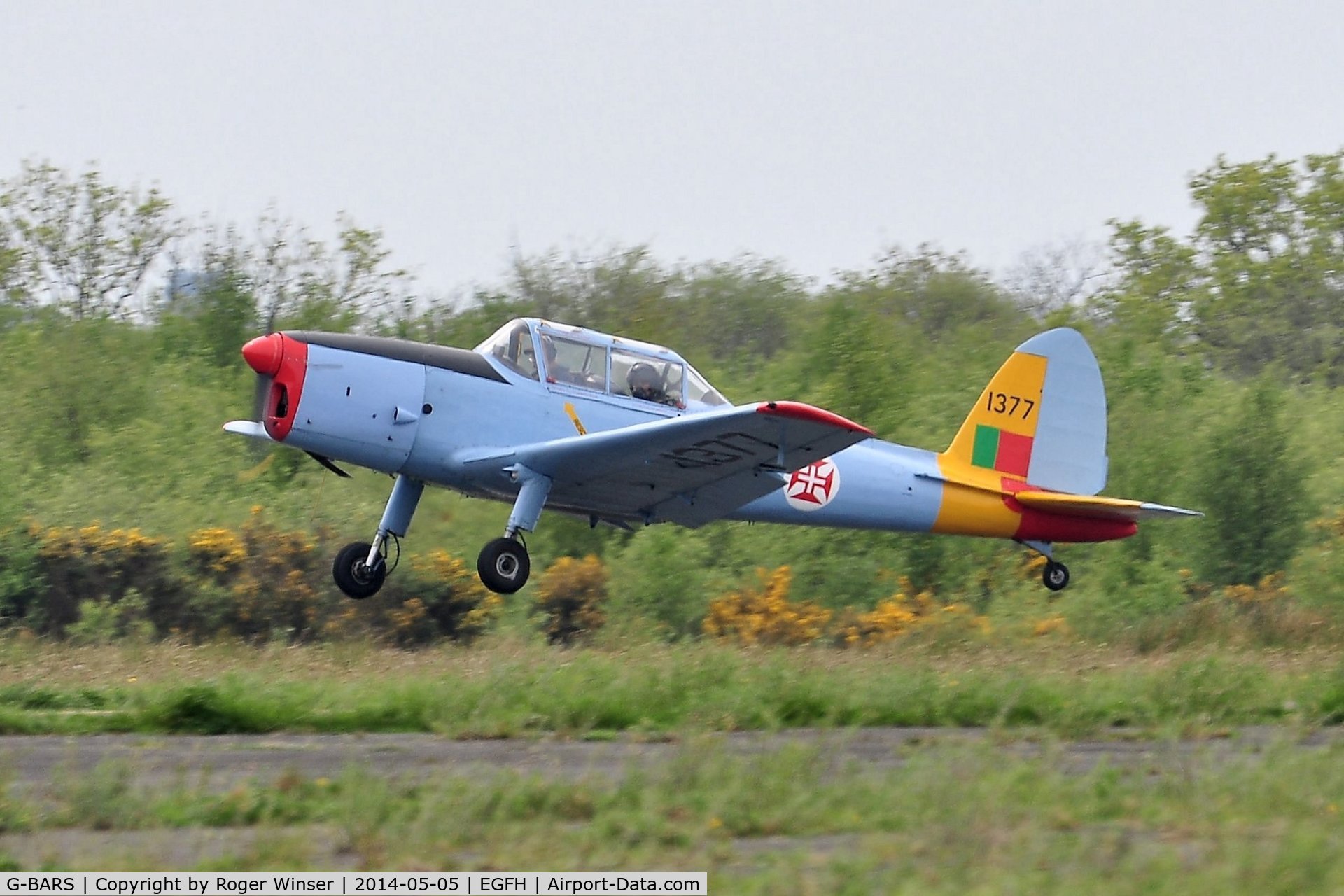 G-BARS, 1952 De Havilland DHC-1 Chipmunk T.10 C/N C1/0557, Visiting Chipmunk departing Runway 10. The aircraft served in the RAF as WK520. Painted to represent a Chipmunk in the Portuguese Air Force with the s/n 1377. 