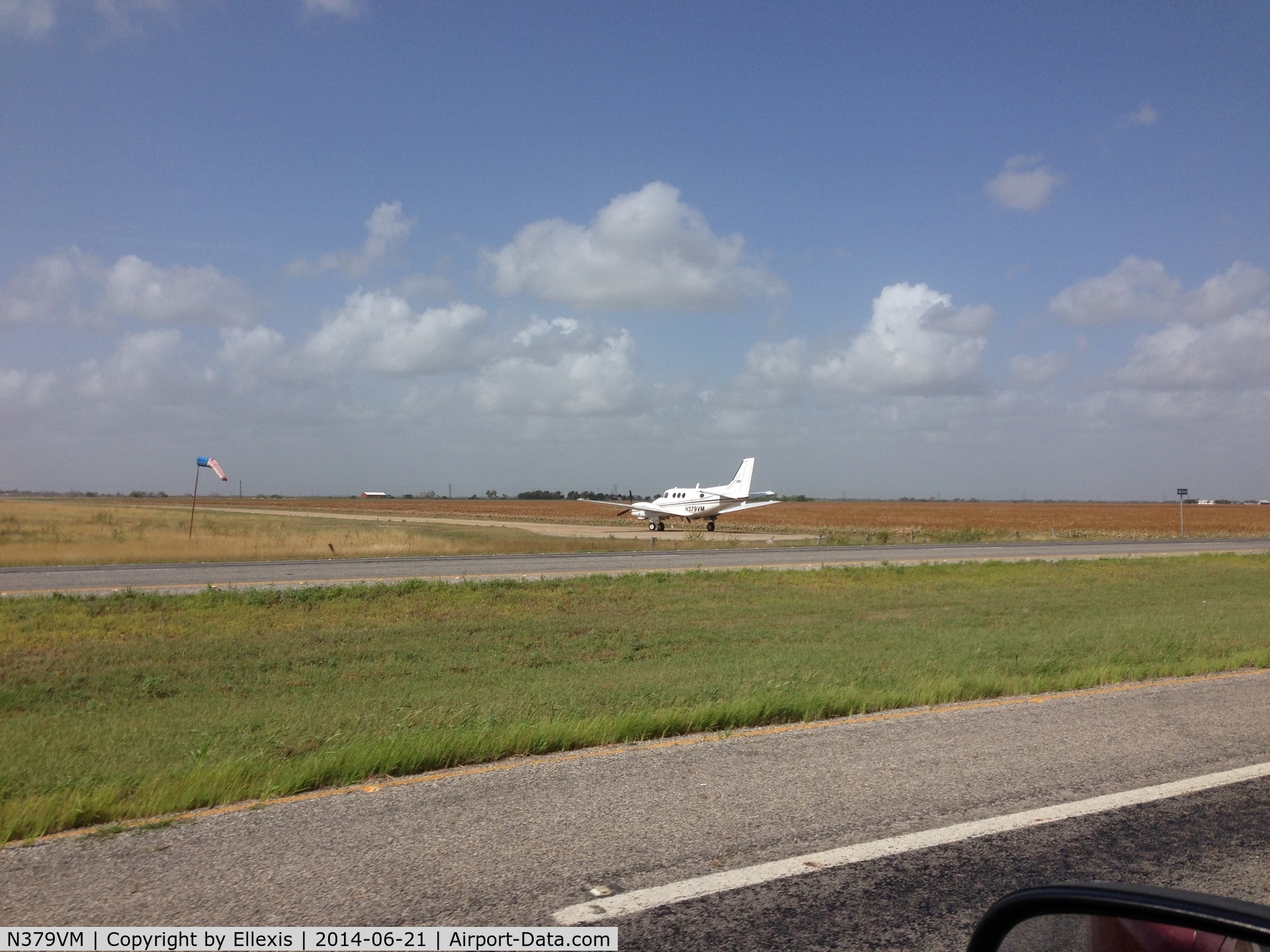 N379VM, 1972 Beech E-90 King Air C/N LW-27, While driving to Laredo on TX-44 near Robstown, TX, N379VM lined up on a dirt runway for takeoff.
