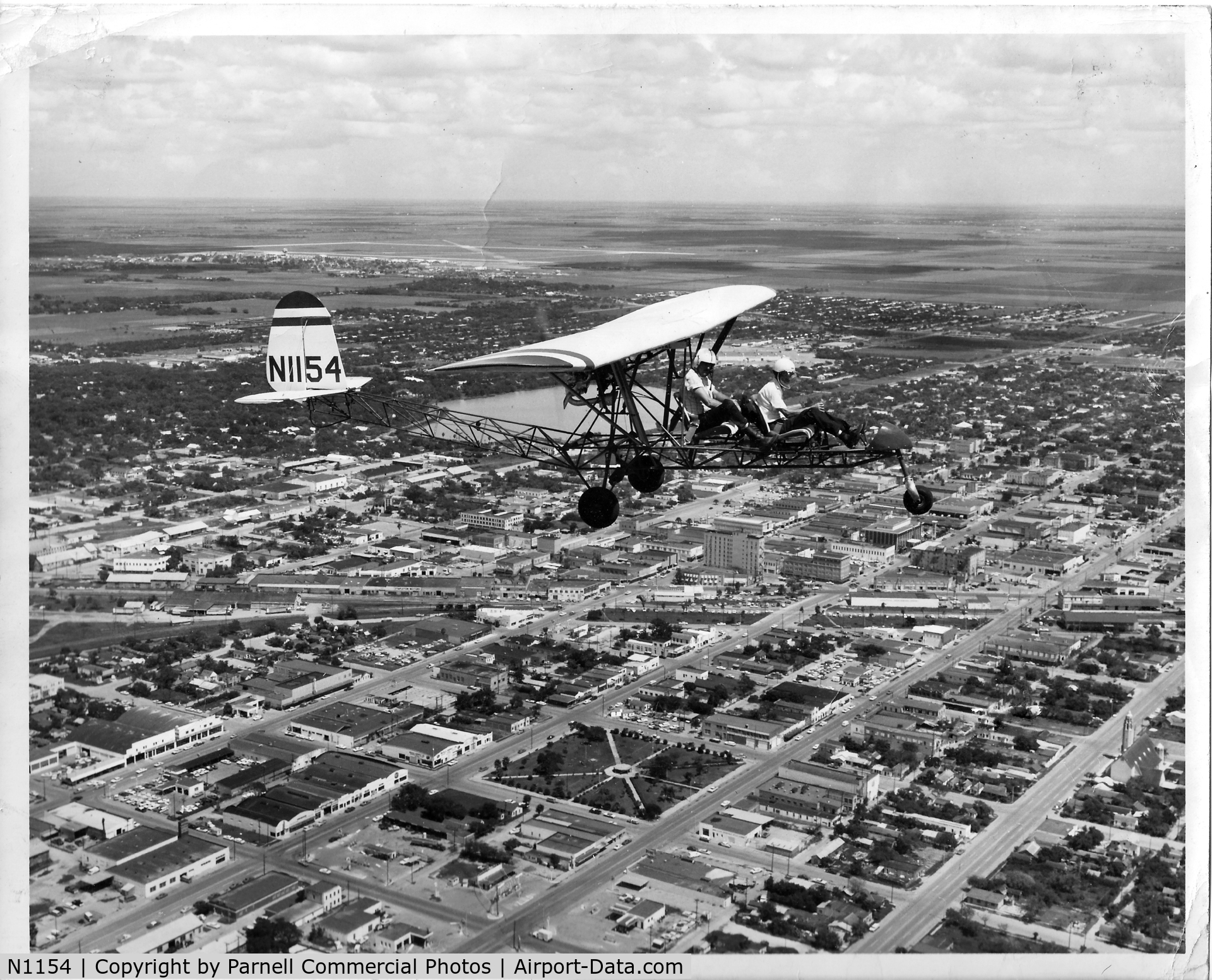 N1154, 1968 Breezy RLU-1 C/N 1, When I was about 12 (1969), I rode in this Breezy with the original builder/owner (front seat in photo), a family friend, at Confederate Air Force Base, Harlingen, Texas (background). Photo was a souvenir after my thrilling ride. Can't remember names.