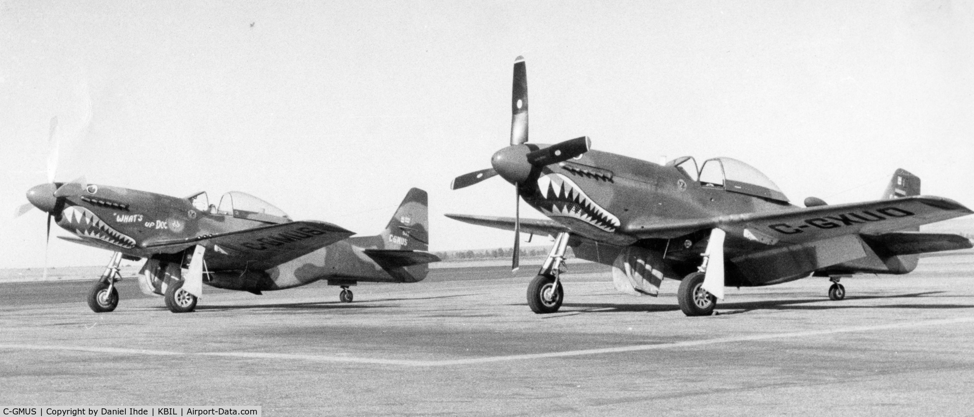 C-GMUS, 1968 North American F-51D Mustang Mustang C/N AF6722581, C-GMUS along side C-GXUO at BIL for a fuel stop.  1983