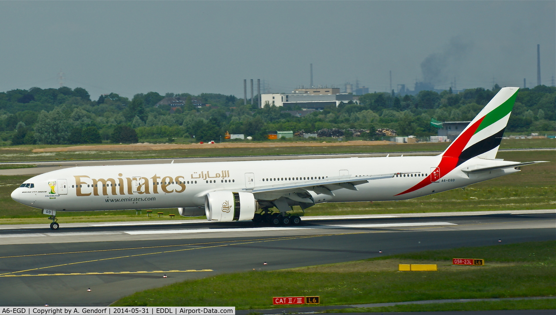 A6-EGD, 2011 Boeing 777-31H/ER C/N 38988, Emirates (2014 Fifa World Cup Brasil sticker), had just arrived from Dubai(OMDB) at Düsseldorf Int'l(EDDL)