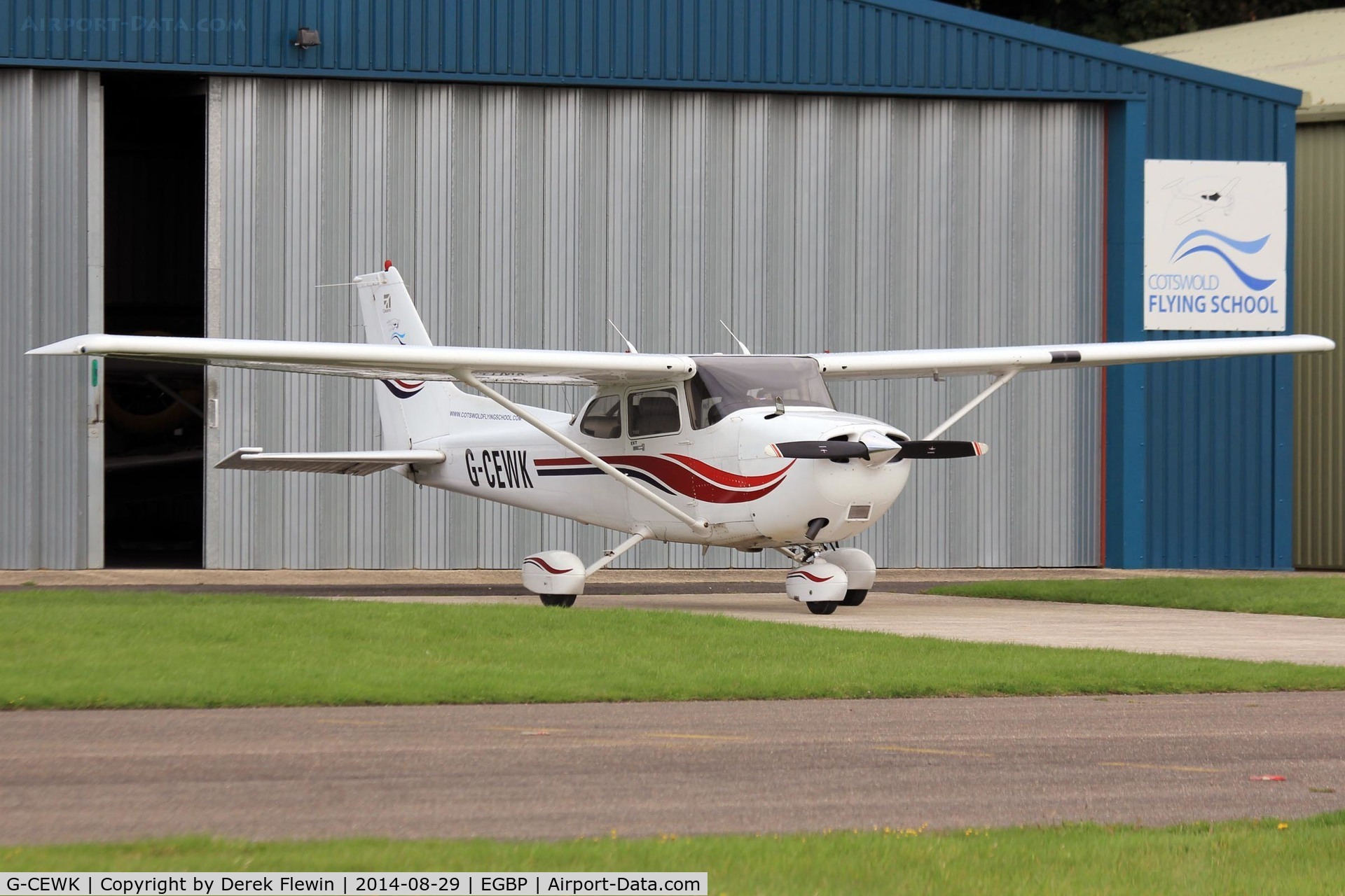 G-CEWK, 1999 Cessna 172S Skyhawk SP C/N 172S8294, Kemble based, Skyhawk, seen outside its' hangar at EGBP.