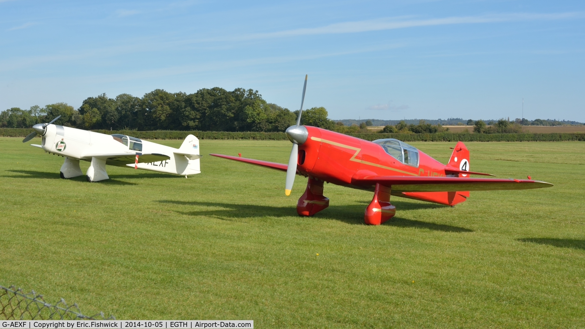 G-AEXF, 1936 Percival E-2H Mew Gull C/N E22, 5. G-AWXF with G-HEKL at the rousing season finale Race Day Air Show at Shuttleworth, Oct. 2014.