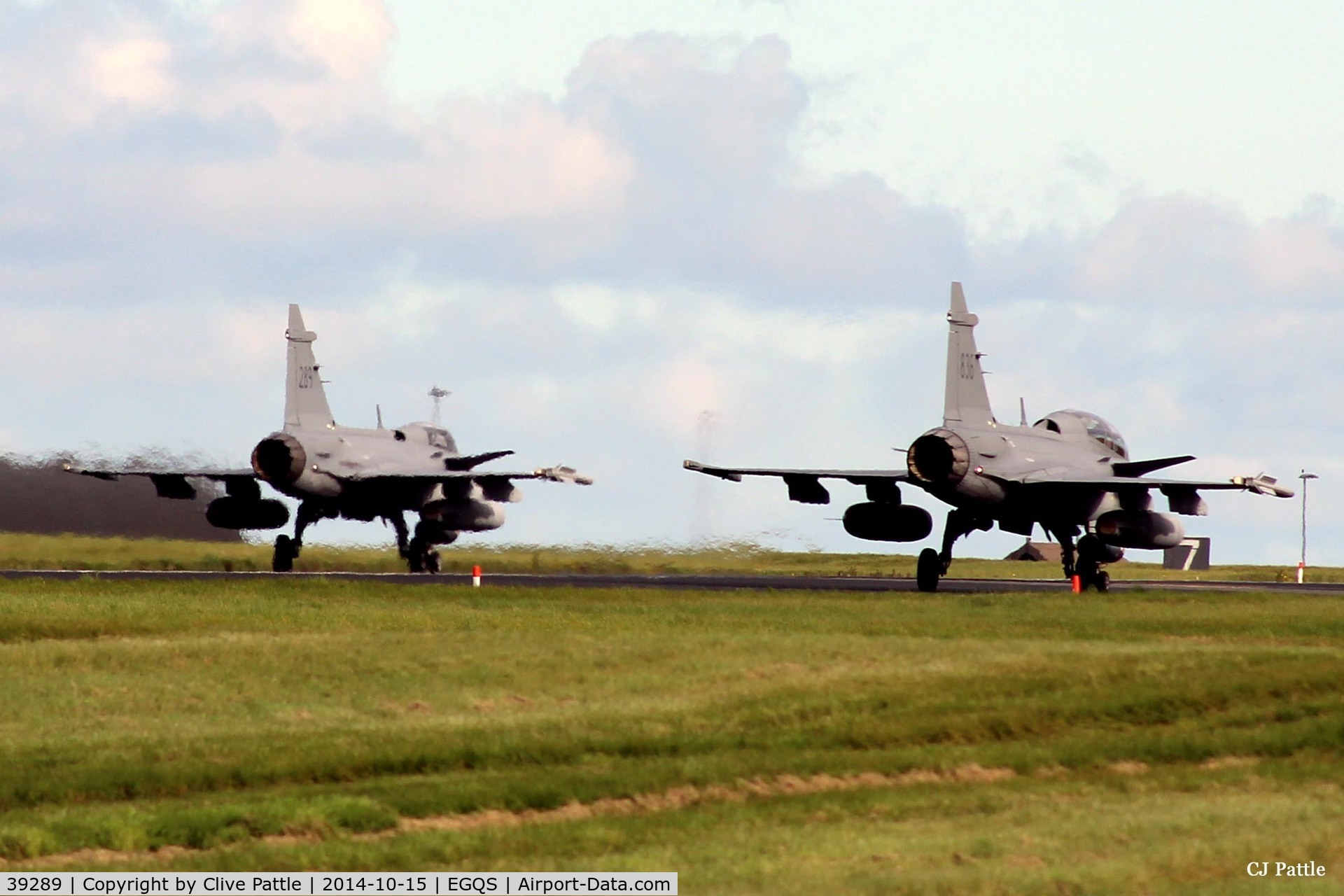 39289, Saab JAS-39C Gripen C/N 39289, Holding for departure (on left) with a colleague in a 'D' model  twin seater on runway 05 at RAF Lossiemouth whilst participating in Exercise Joint Warrior 14-2