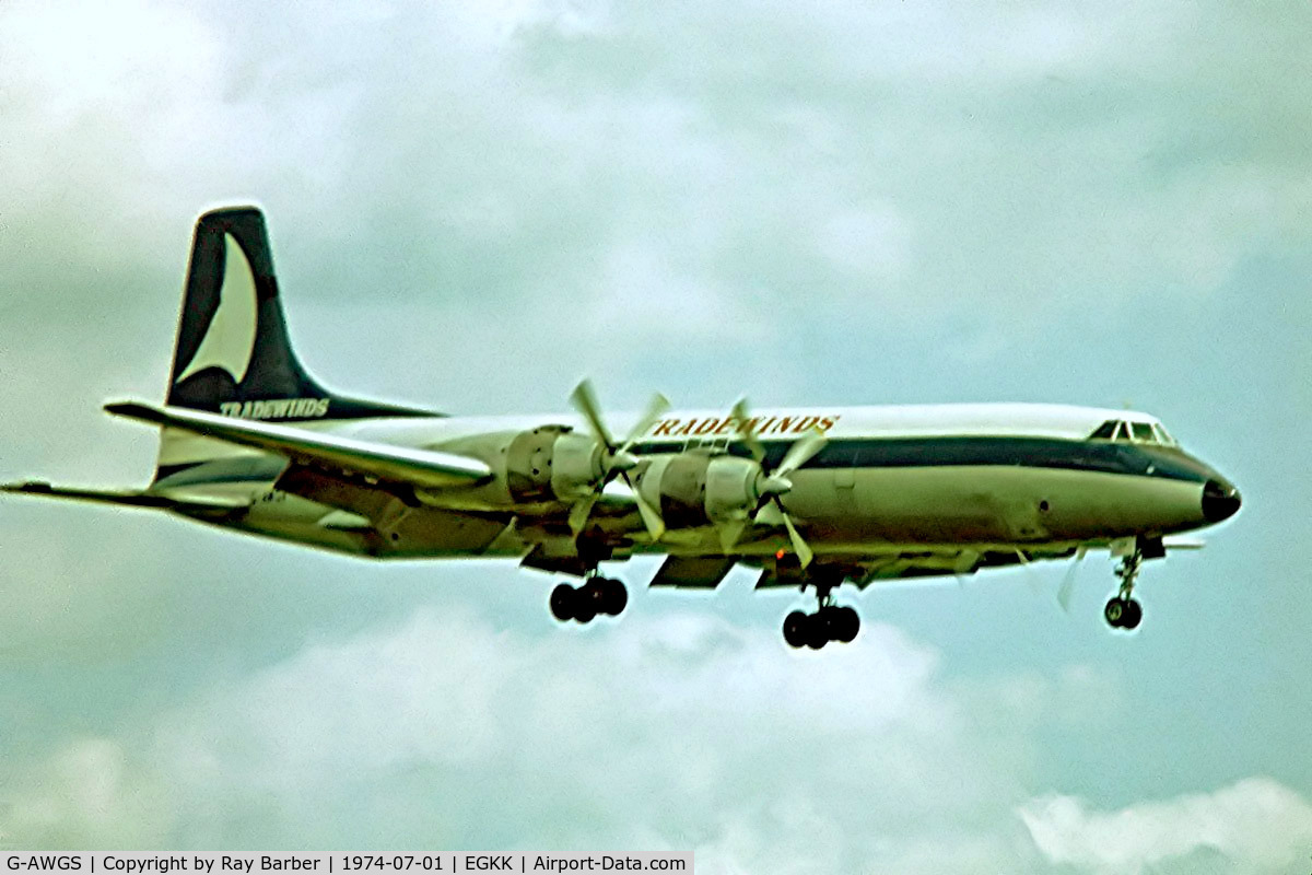 G-AWGS, 1961 Canadair CL-44D4-1 C/N 27, Canadair CL-44D4-1 [27] (Tradewinds) Gatwick~G 01/07/1974. From a slide.