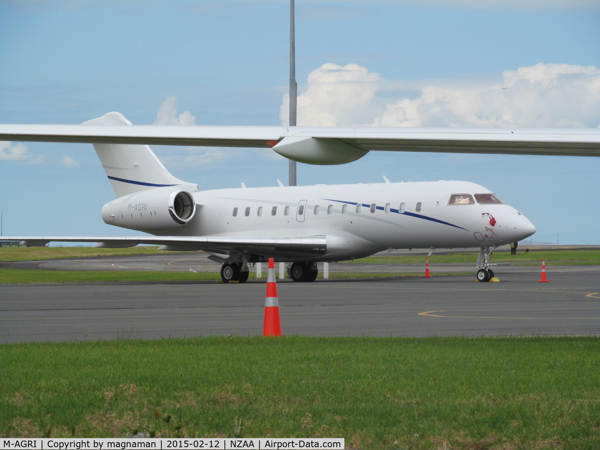M-AGRI, 2014 Bombardier BD-700-1A11 Global 5000 C/N 9597, Still at AKL (leaves today) seen under wing of M-AAAL