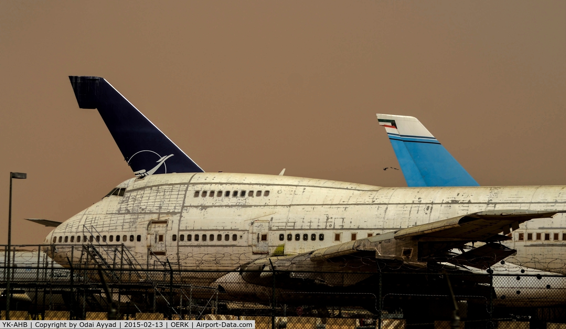 YK-AHB, 1976 Boeing 747SP-94 C/N 21175, Dusty day in Riyadh Airport and looking sadly to these two B747SP Syrian Airlines which are out of service