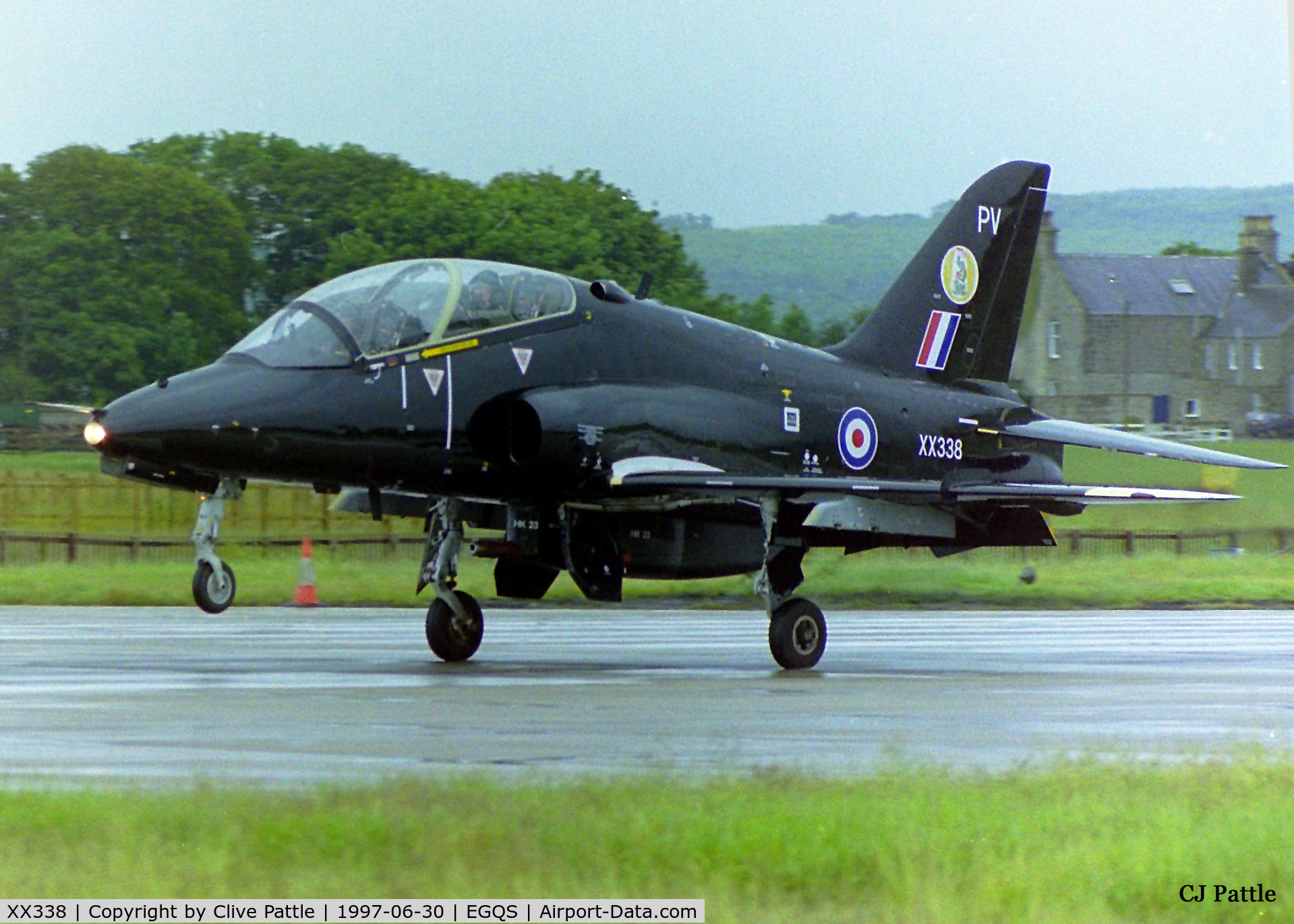 XX338, 1981 Hawker Siddeley Hawk T.1A C/N 187/312162, Nose wheel about to touch whilst landing at RAF Lossiemouth (EGQS) in June 1997 whilst participating in the bi-annual TLT (Tactical Leaders Training) course, whilst serving with 19 R Sqn RAF coded 'PV'