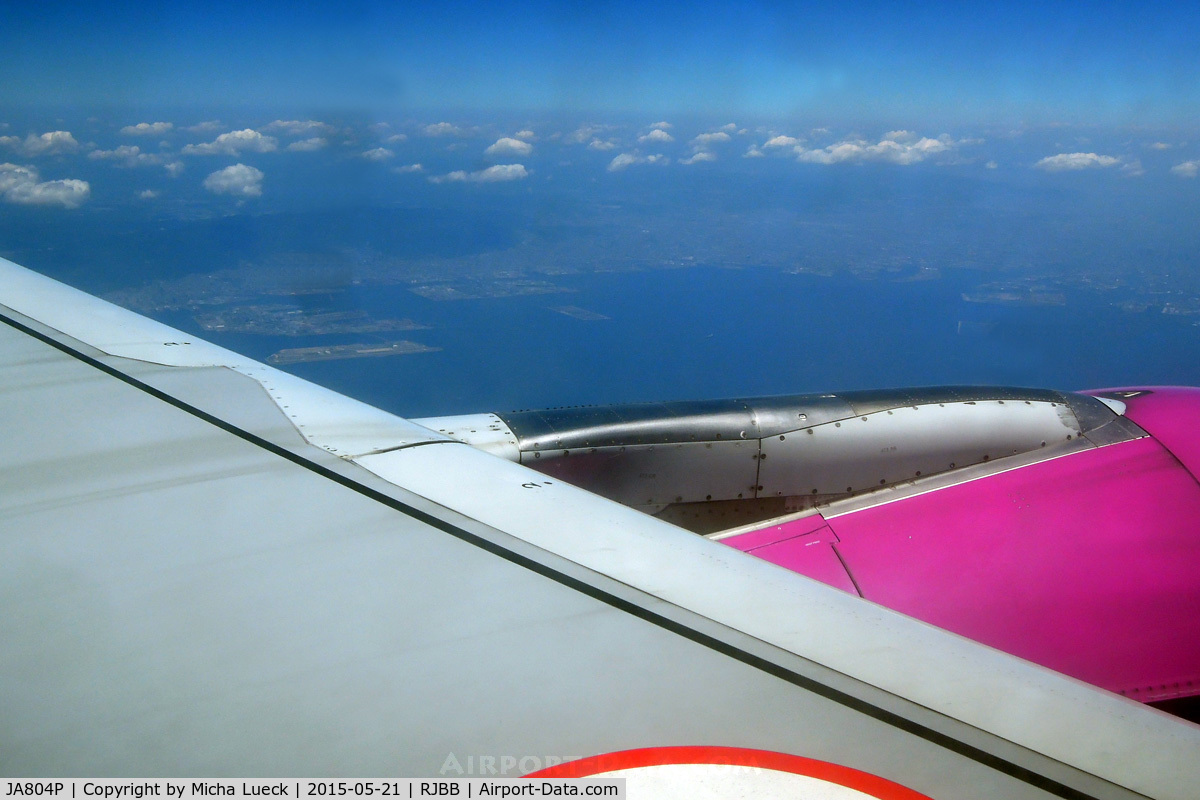 JA804P, 2012 Airbus A320-214 C/N 5166, Climbing out of Kansai after a 180 degree turn (you an see KIX next to the wing, above the engine)